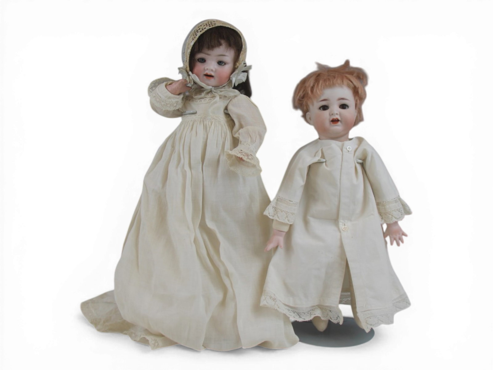 (2) Bisque Baby Dolls: 12.5 inch Kammer & Reinhardt 126 bisque socket head on new cloth and bisque body and a 10 inch PM Grete bisque socket head on fully jointed composition body. Circa 1920s. Shipping: Weiss Auctions