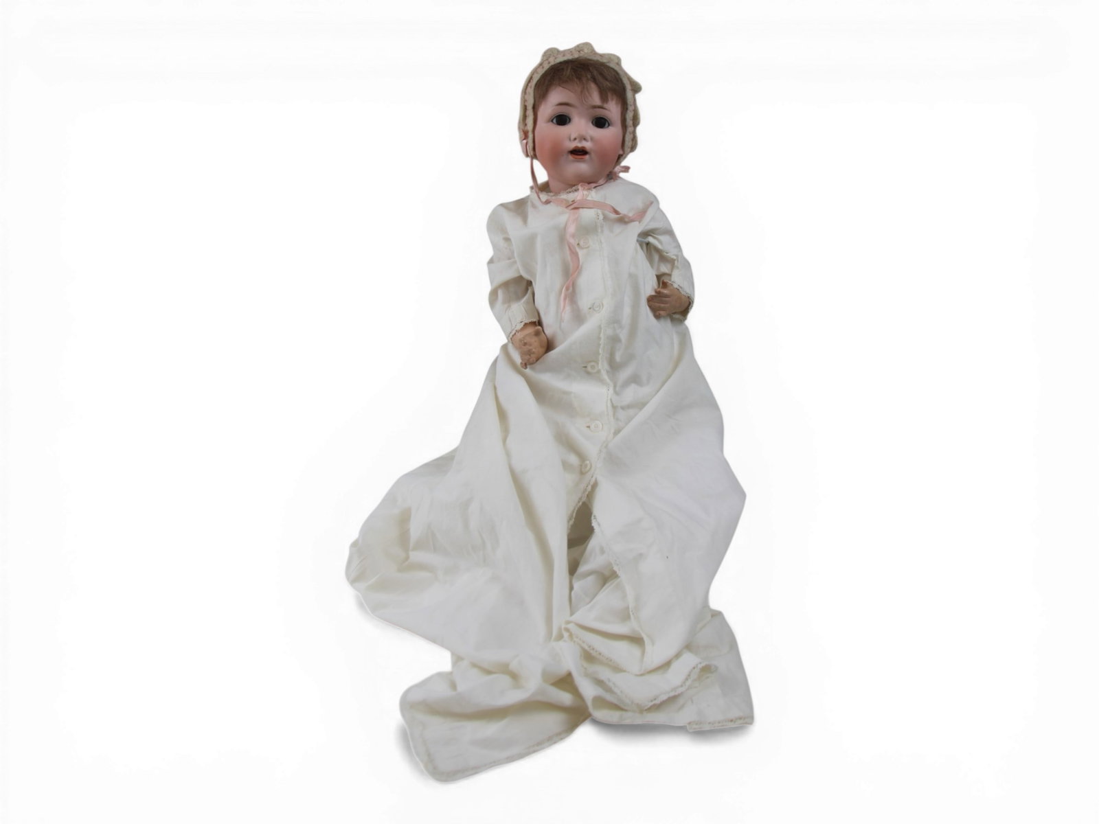 JD Kestner 257 Character Baby Doll: 19 inch bisque socket head on bent limb composition baby body. Circa 1920s. Shipping: Weiss Auctions offers full-service, in-house shipping for nearly all items in this auction. For a shipping quote,