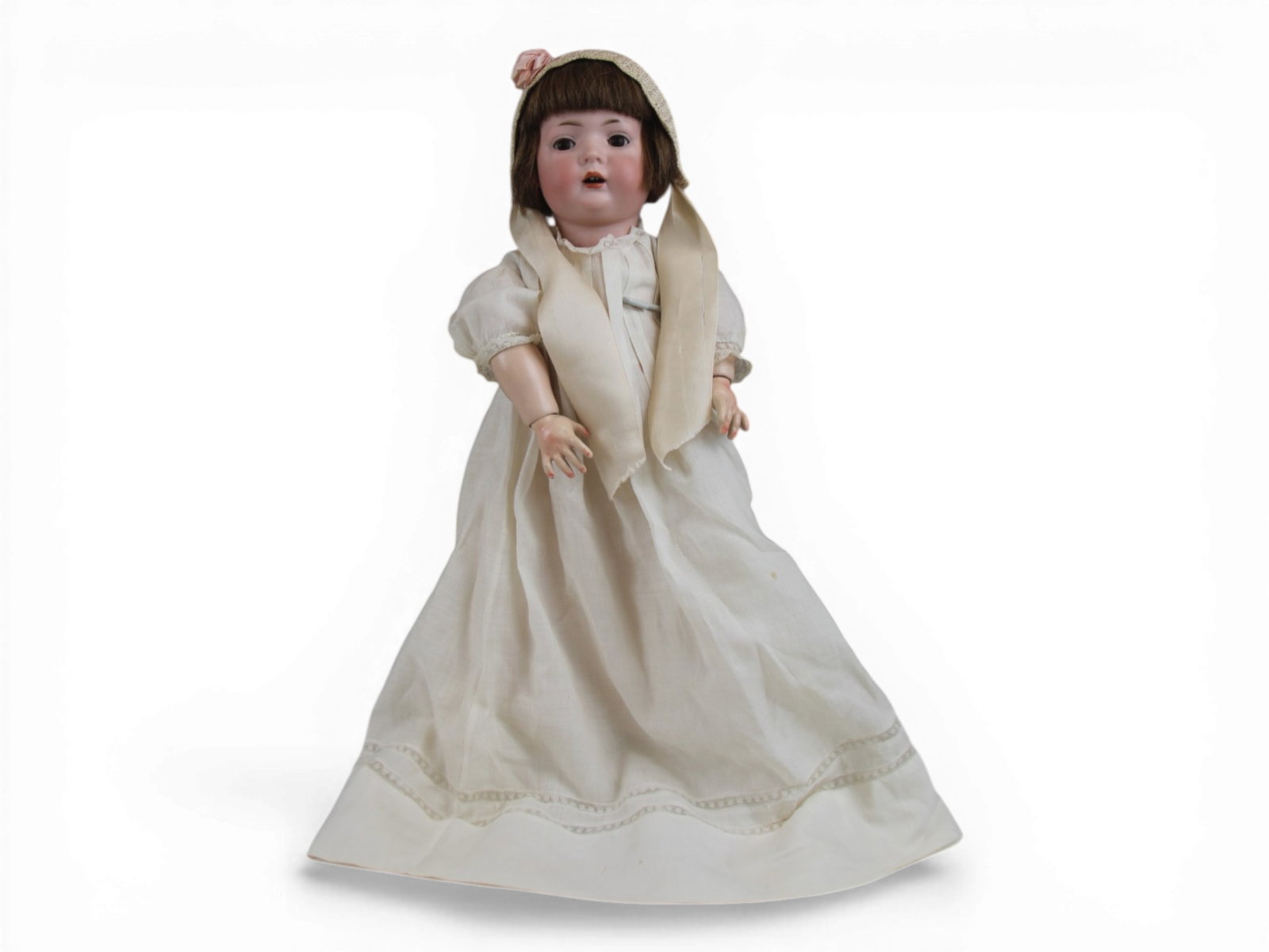 Bruno Schmidt Bisque Toddler Doll: 15 inch bisque socket head on fully jointed composition toddler body with original human hair wig. Circa 1920s. Shipping: Weiss Auctions offers full-service, in-house shipping for nearly all items in 