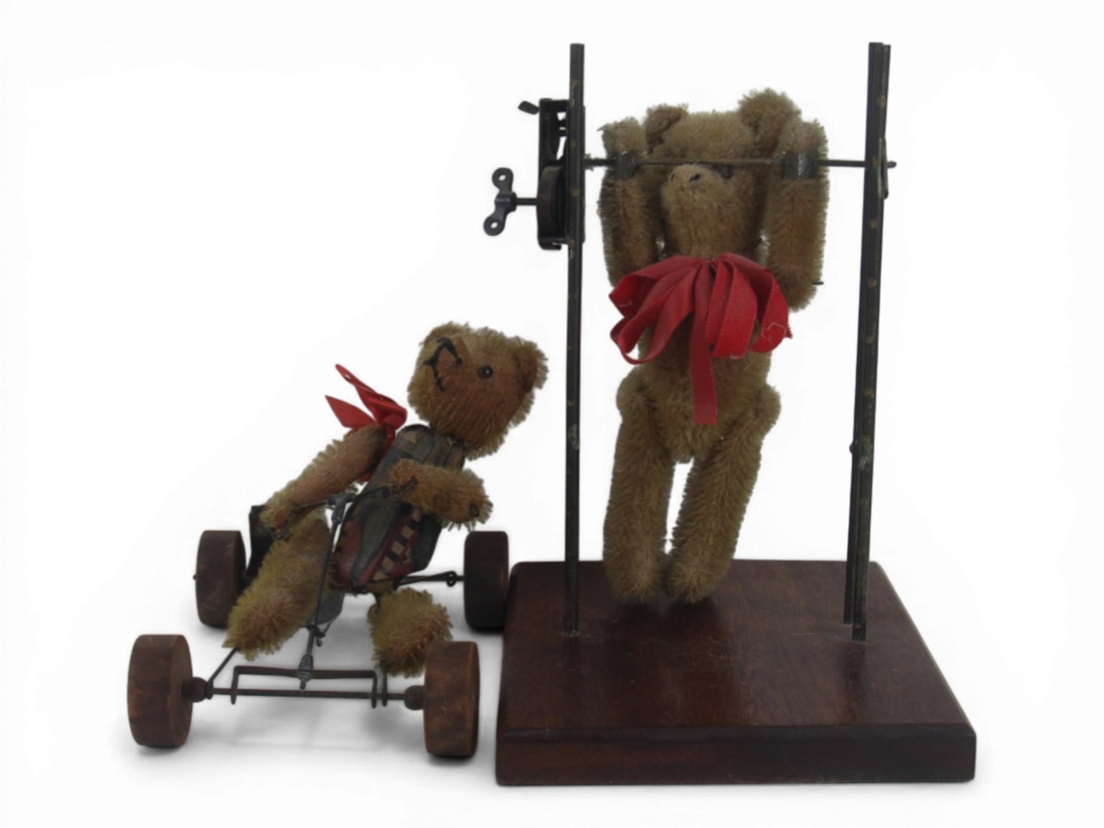(2) Schuco Attributed Mechanical Bears: Two Schuco attributed mechanical bears including a trapeze bear and an auto bear. Both need mechanical attention. Circa 1920s. Shipping: Weiss Auctions offers full-service, in-house shipping for nearl