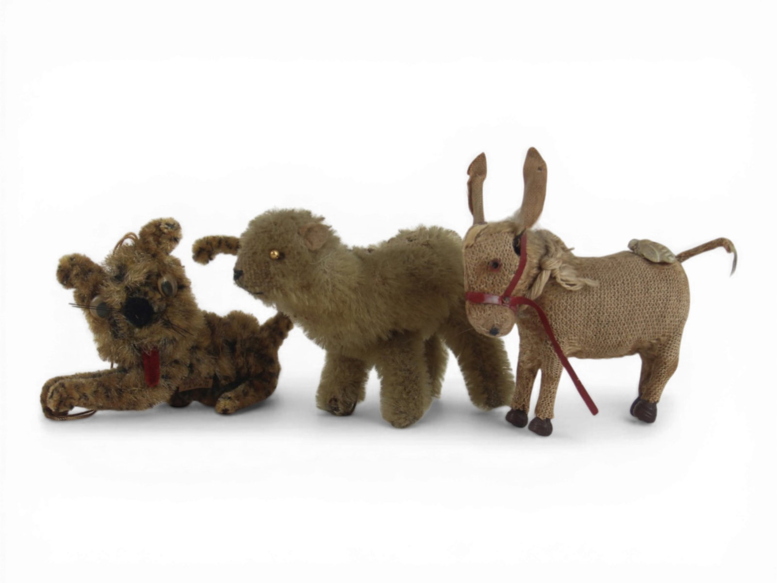 (3) Small Plush and Tin Animals: Group of three including a tin donkey with key and moving ears and tail, a golden mohair lamb, and a chenille leopard ornament made in Japan. Circa 1930s-1960s. Shipping: Weiss Auctions offers full-se
