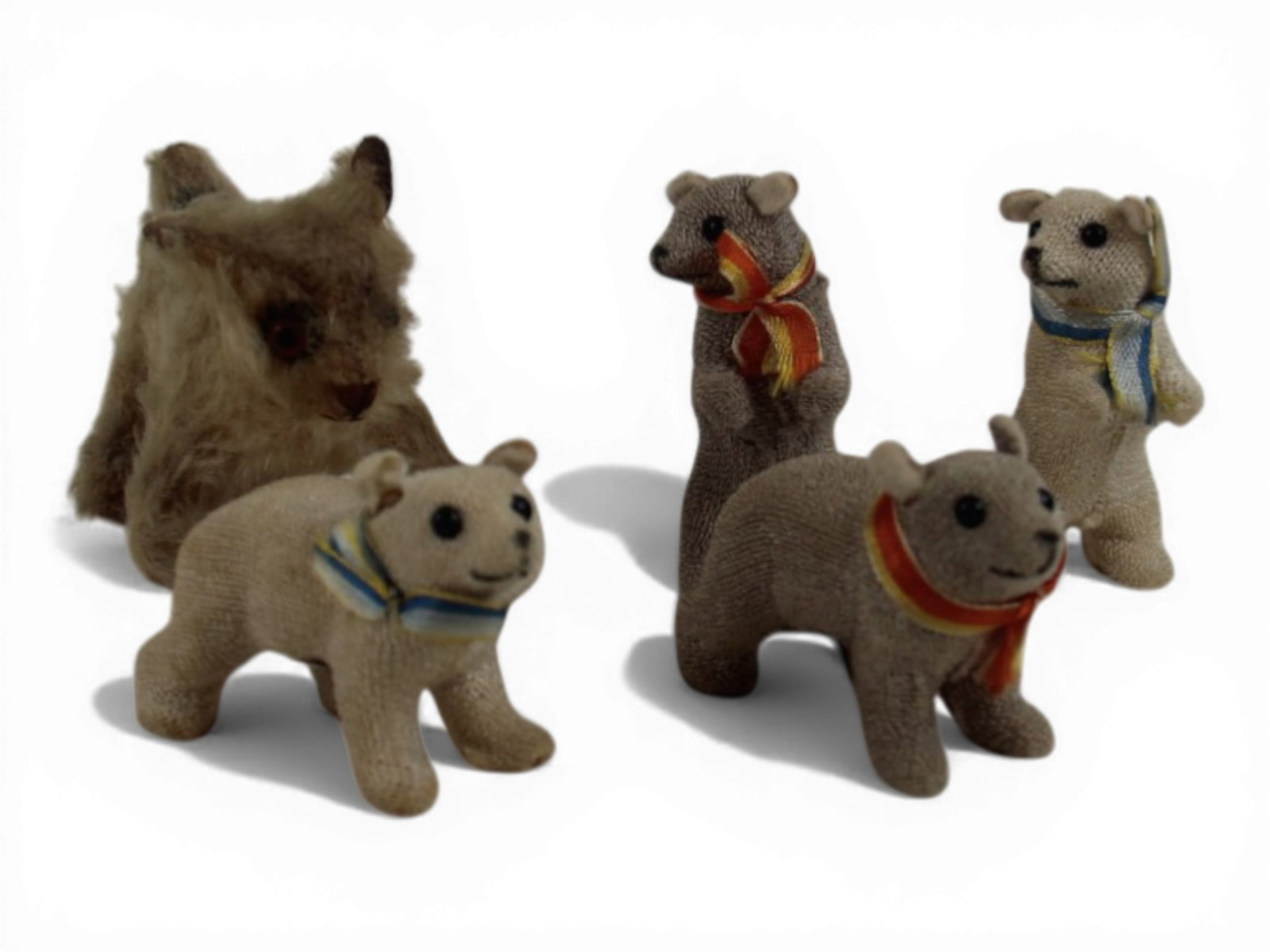 (5) Small Vintage Bears: Group of five including a small Steiff tan mohair bear with glass eyes and early tin tag marked Steiff with long hanging F, plus four cloth covered bear figurines made in Germany. Circa 1906-1950s. Sh