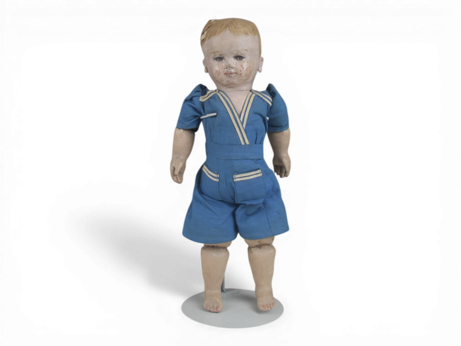 Martha Chase Oilcloth Boy Doll: 16 inch Martha Chase boy with hand painted oilcloth and original clothes. Some wear to face and damage to head. Circa 1910. Shipping: Weiss Auctions offers full-service, in-house shipping for nearly a