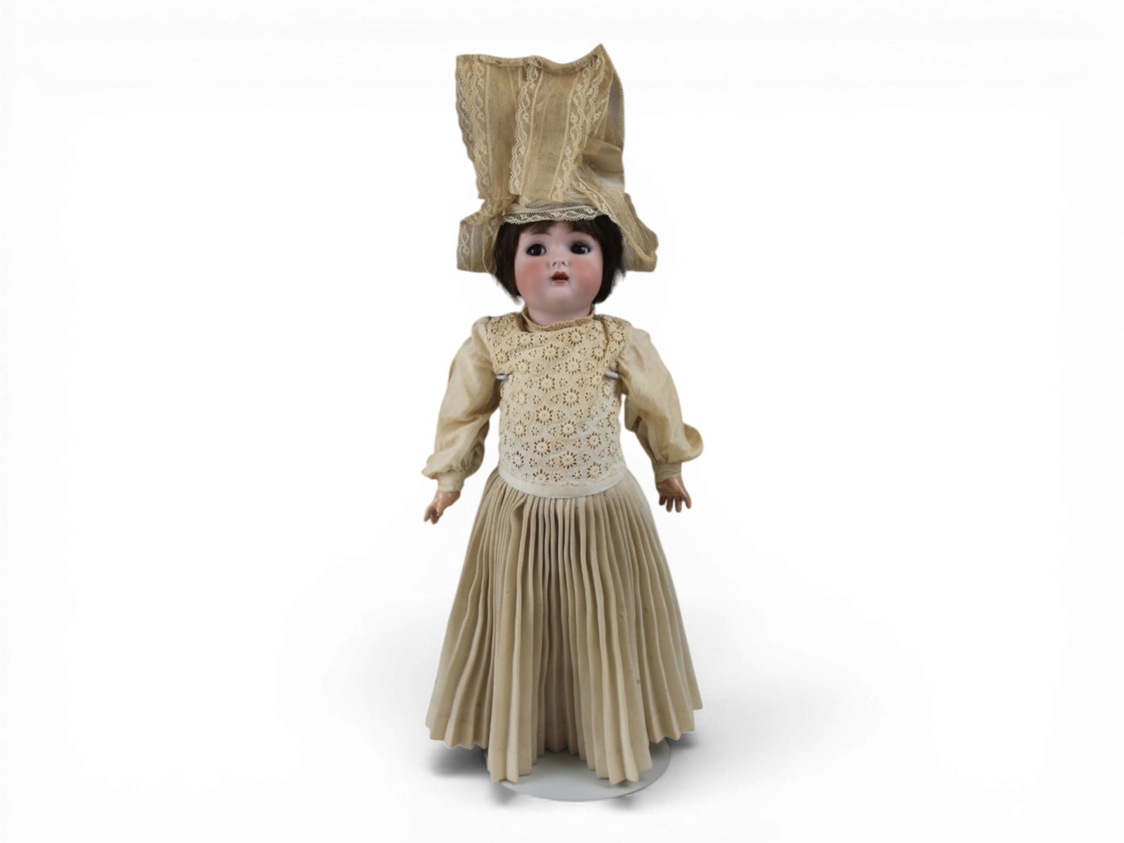 K&R Flirty Dolly in Regional Costume: 18 inch bisque socket head on fully jointed composition and wood body with flirty eyes and antique regional costume. Circa 1910. Shipping: Weiss Auctions offers full-service, in-house shipping for nea