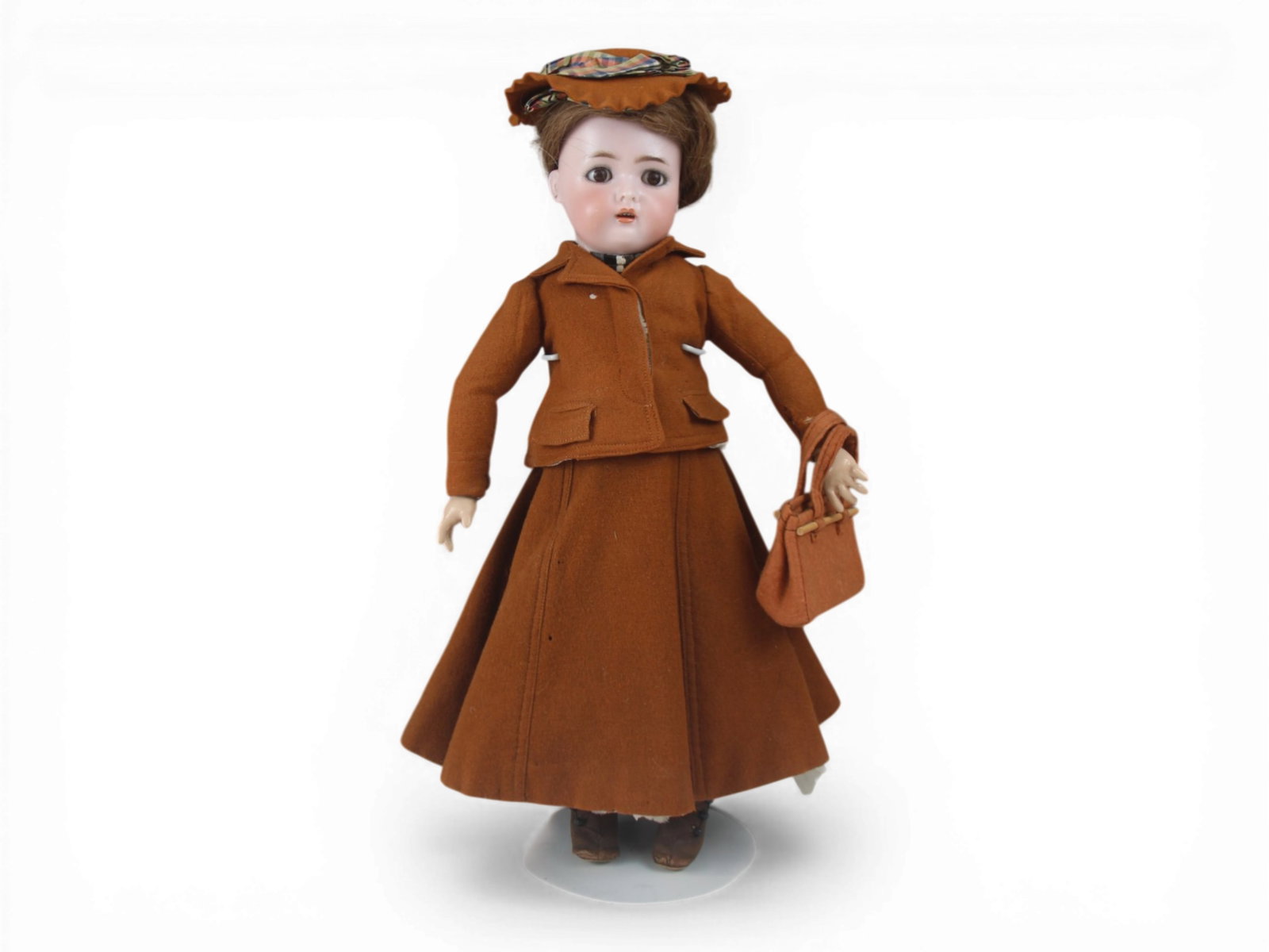 K&R Bisque Dolly: 18 inch bisque socket head on fully jointed wood and composition body, all original. Circa 1910. Shipping: Weiss Auctions offers full-service, in-house shipping for nearly all items in this auction. F