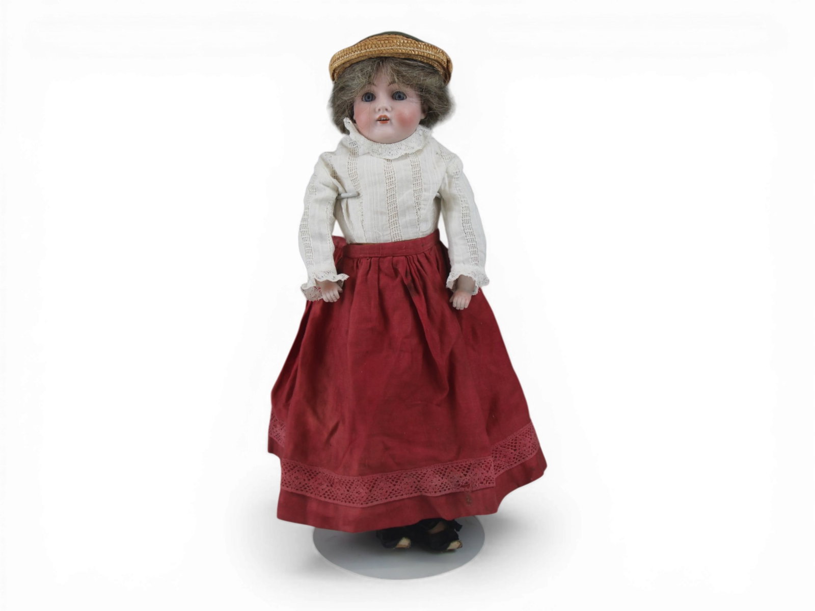 Kestner 154 Shoulder Head Doll: 17 inch bisque shoulder head on kidskin body with bisque lower arms, pin jointed elbows and knees, and antique costume. Circa 1900s. Shipping: Weiss Auctions offers full-service, in-house shipping for