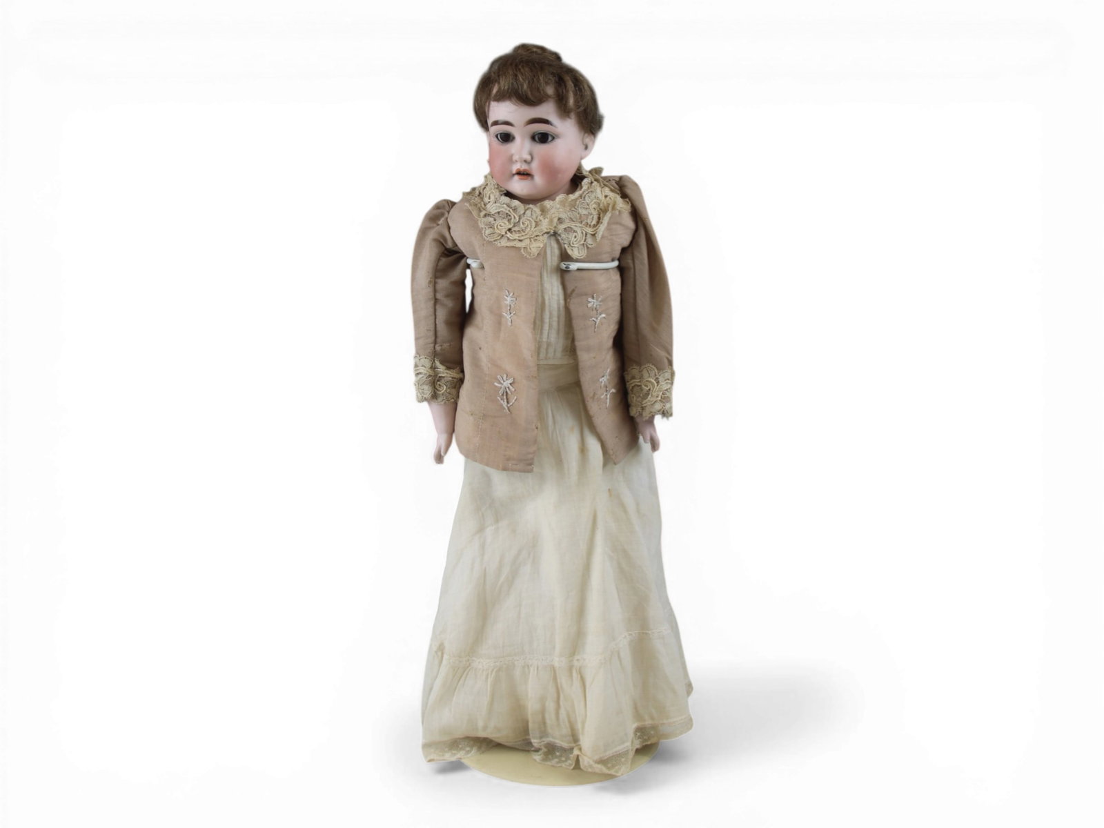 Armand Marseille Shoulder Head Doll: 24 inch bisque shoulder head on kidskin body with bisque lower arms and antique costume. Circa 1890s. Shipping: Weiss Auctions offers full-service, in-house shipping for nearly all items in this aucti