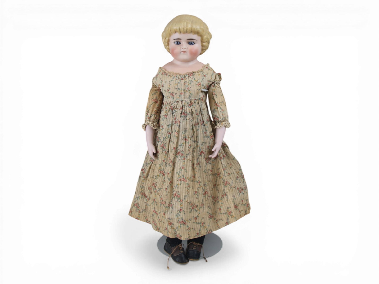 Tinted Bisque Shoulder Head Doll: 20 inch tinted bisque shoulder head closed mouth with molded hair on kidskin body with bisque lower arms, with antique costume. Body offered as is with break to right foot. Circa 1890. Shipping: Weiss
