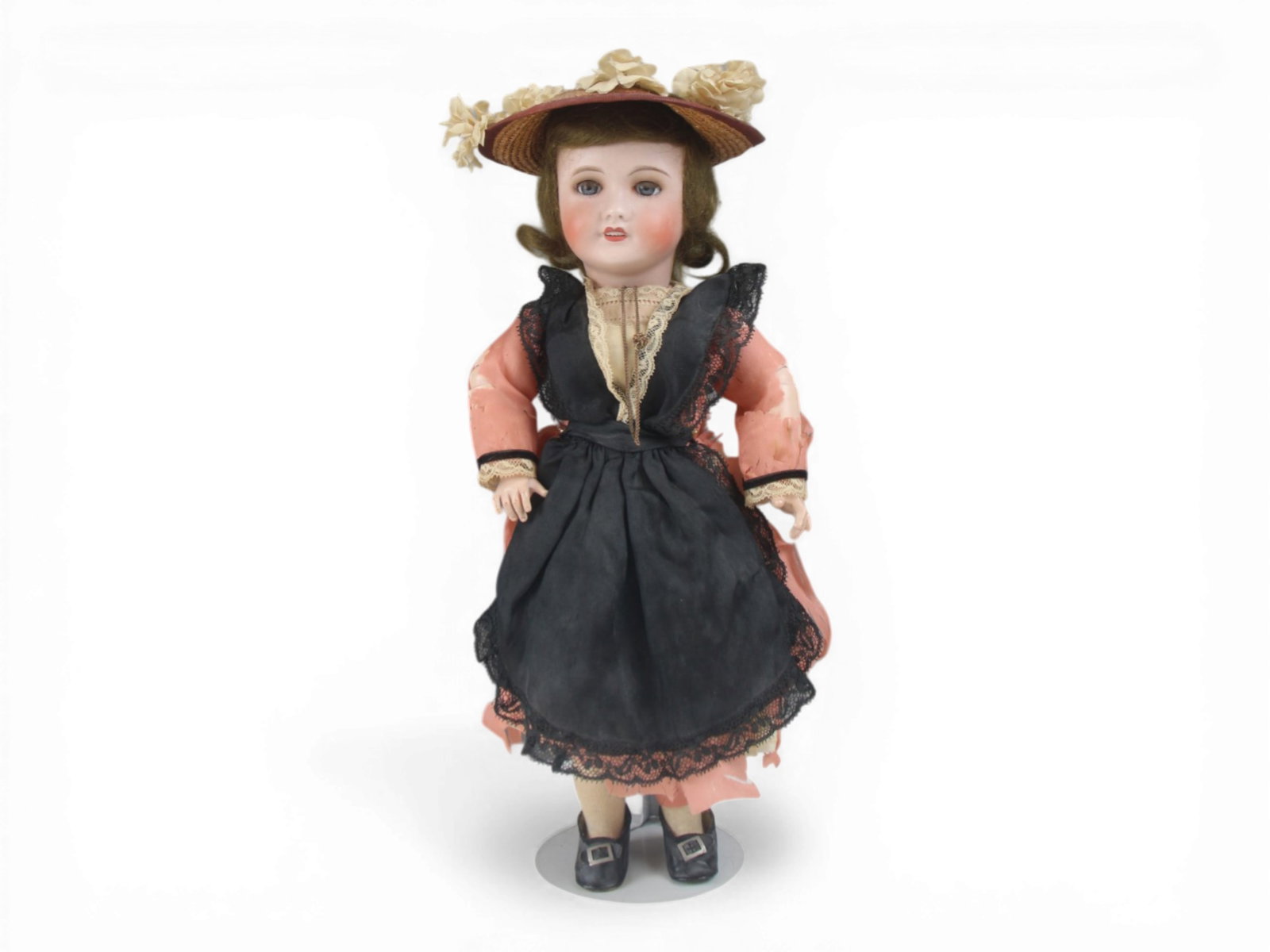 UNIS 301 French Dolly: 16.5 inch UNIS 301 bisque head on fully jointed composition and wood body with original regional costume. Costume shredding noted. Circa 1925. Shipping: Weiss Auctions offers full-service, in-house sh