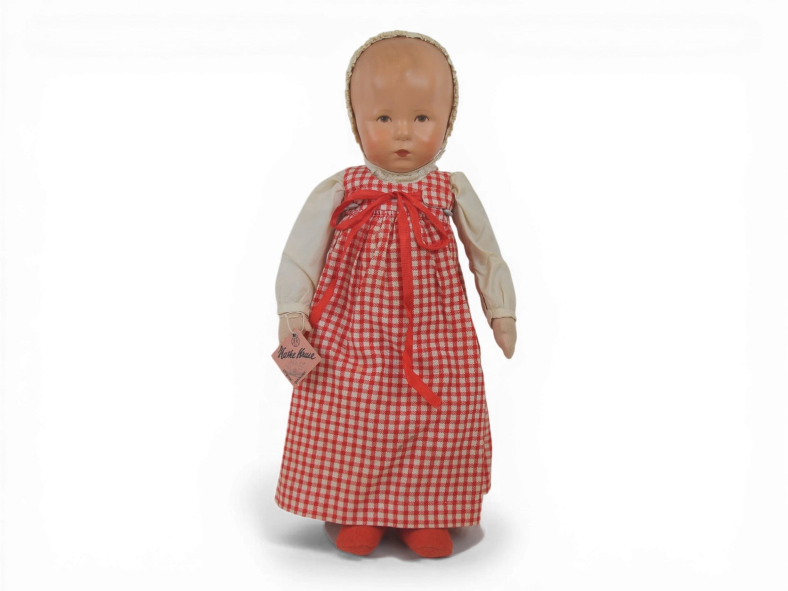 Kathe Kruse Baby Doll: 18 inch Kathe Kruse baby with painted oilcloth head on cloth body, all original with tag Made in US Zone Germany, numbered and signed on foot. Circa 1940s. Shipping: Weiss Auctions offers full-service