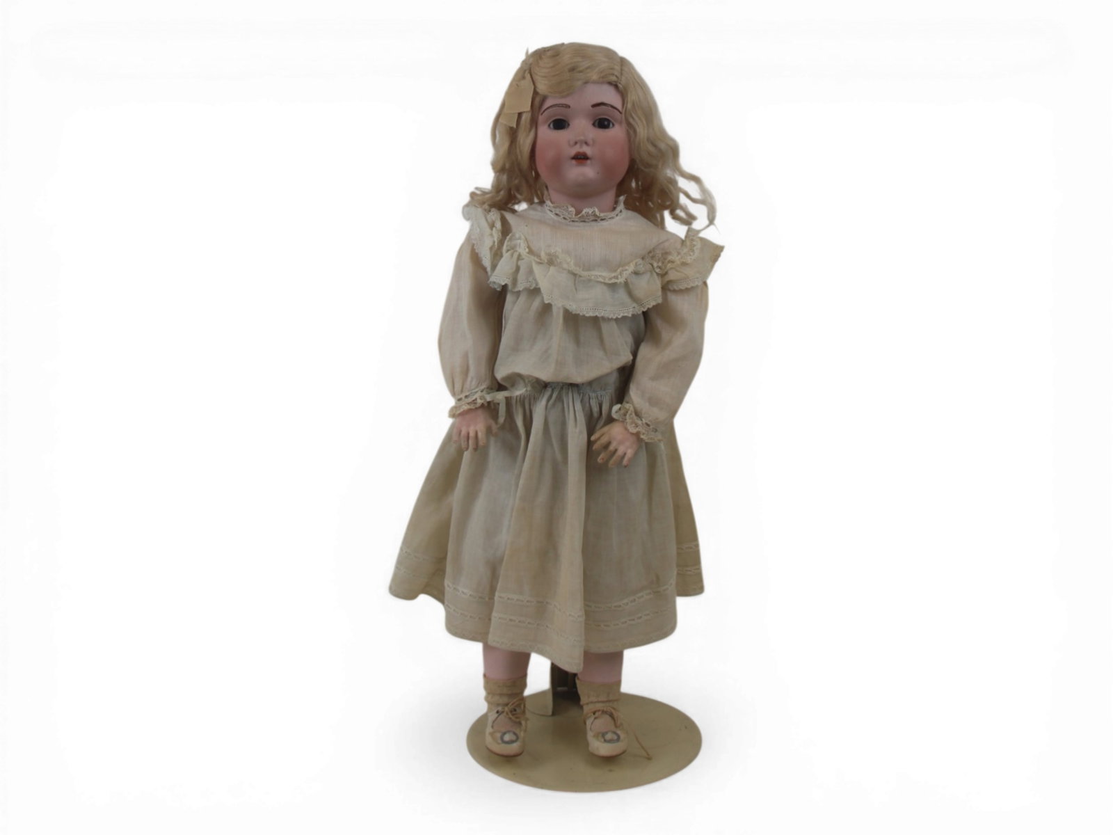 Kestner 196 Bisque Head Doll: 26 inch Kestner 196 bisque socket head on fully jointed composition and wood body with fur brows and original antique clothes. Circa 1910. Shipping: Weiss Auctions offers full-service, in-house shippi
