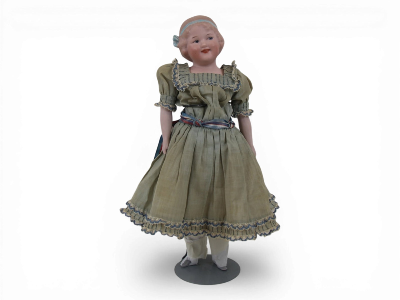 Gebruder Heubach 7850 Coquette Doll: 12 inch Gebruder Heubach 7850 Coquette with bisque shoulder head on cloth body with bisque limbs, all original. Circa 1920. Shipping: Weiss Auctions offers full-service, in-house shipping for nearly a
