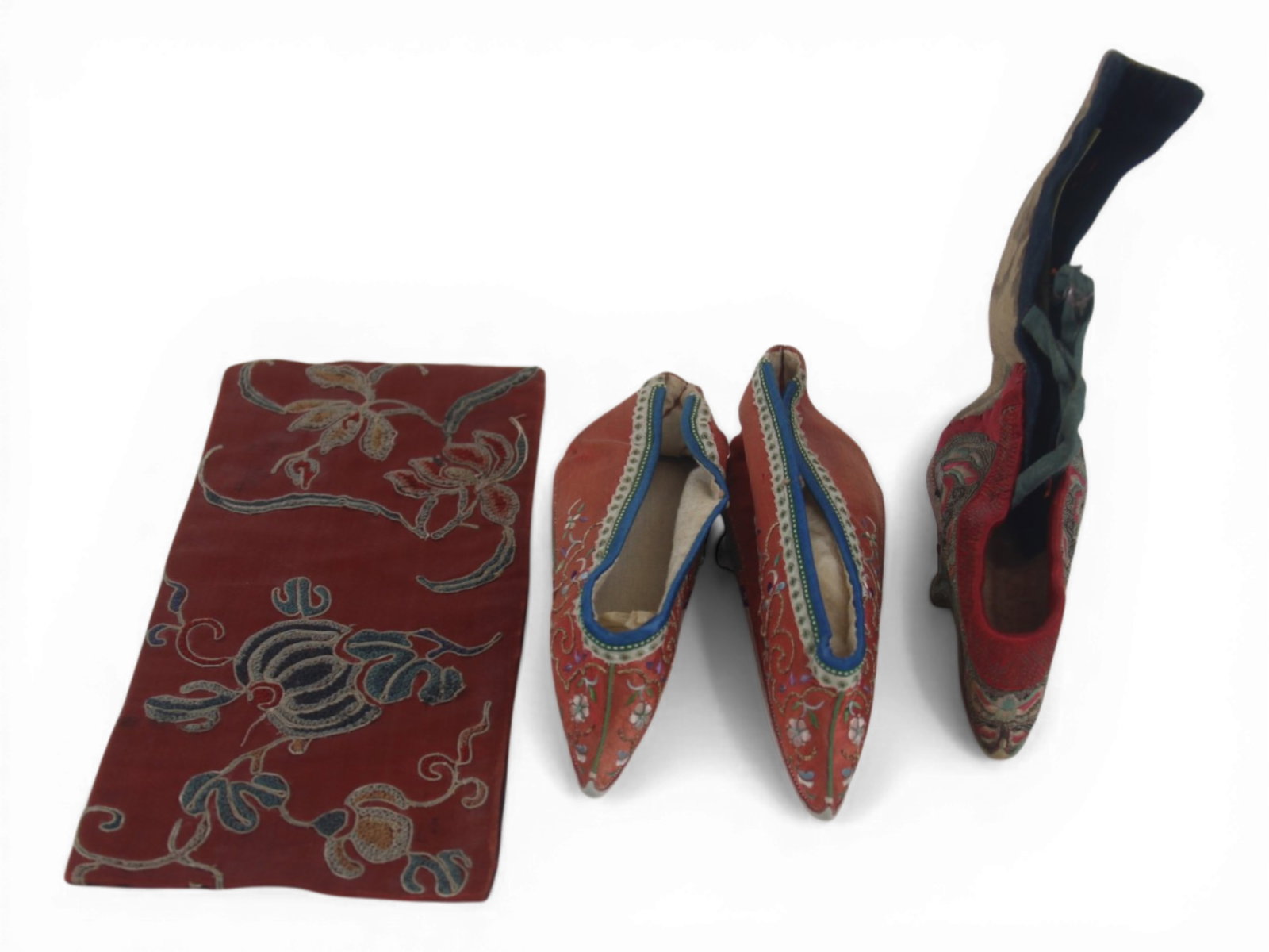 (4) Chinese Silk Shoes for Bound Feet: Group of Chinese embroidered silk shoes for bound feet including one very rare single shoe measuring approximately 4 by 6 inches with wear to sole, accompanied by a newer unworn pair, plus an