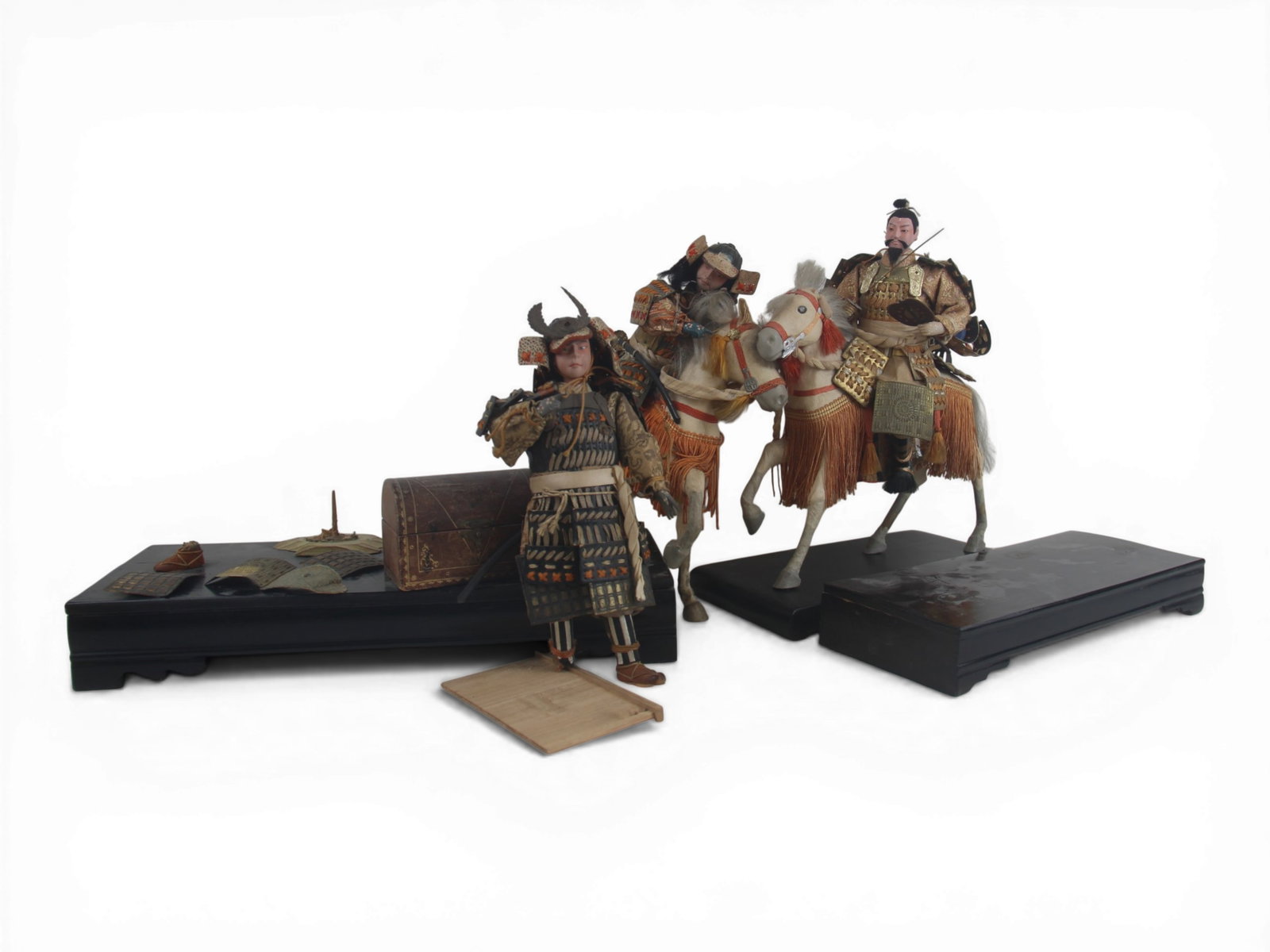 (3) Antique Samurai Dolls: Three antique Japanese samurai dolls measuring approximately 11 to 12 inches, two on horseback, with elaborate original costumes. Circa 1890. Shipping: Weiss Auctions offers full-service, in-house shi