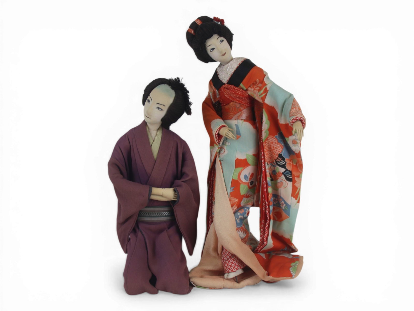 (2) Japanese Cloth Dolls on Stands: Pair of Japanese cloth dolls on stands portraying a couple, with original clothing. Circa 1960s. Shipping: Weiss Auctions offers full-service, in-house shipping for nearly all items in this auction. F
