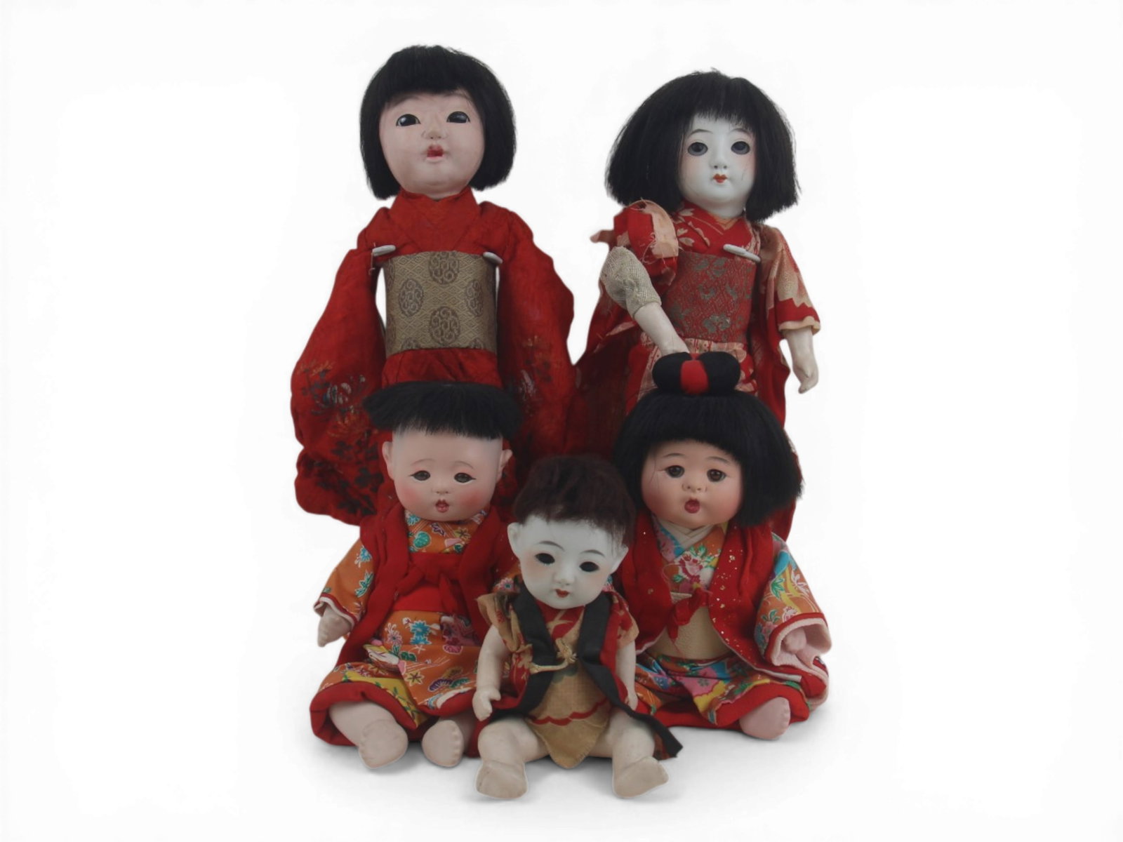 (5) Asian Dolls: Group of five Asian dolls measuring 13 to 8 inches including papier mache and porcelain examples with original costumes. Circa 1920s-1950s. Shipping: Weiss Auctions offers full-service, in-house shipp