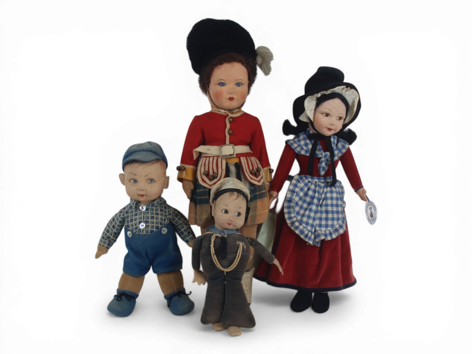 (4) Felt Dolls Including Nora Wellings: Four felt dolls measuring 18 to 9 inches including Nora Wellings lady, sailor, and boy, plus a Chad Valley palace guard. Circa 1940s. Shipping: Weiss Auctions offers full-service, in-house shipping fo