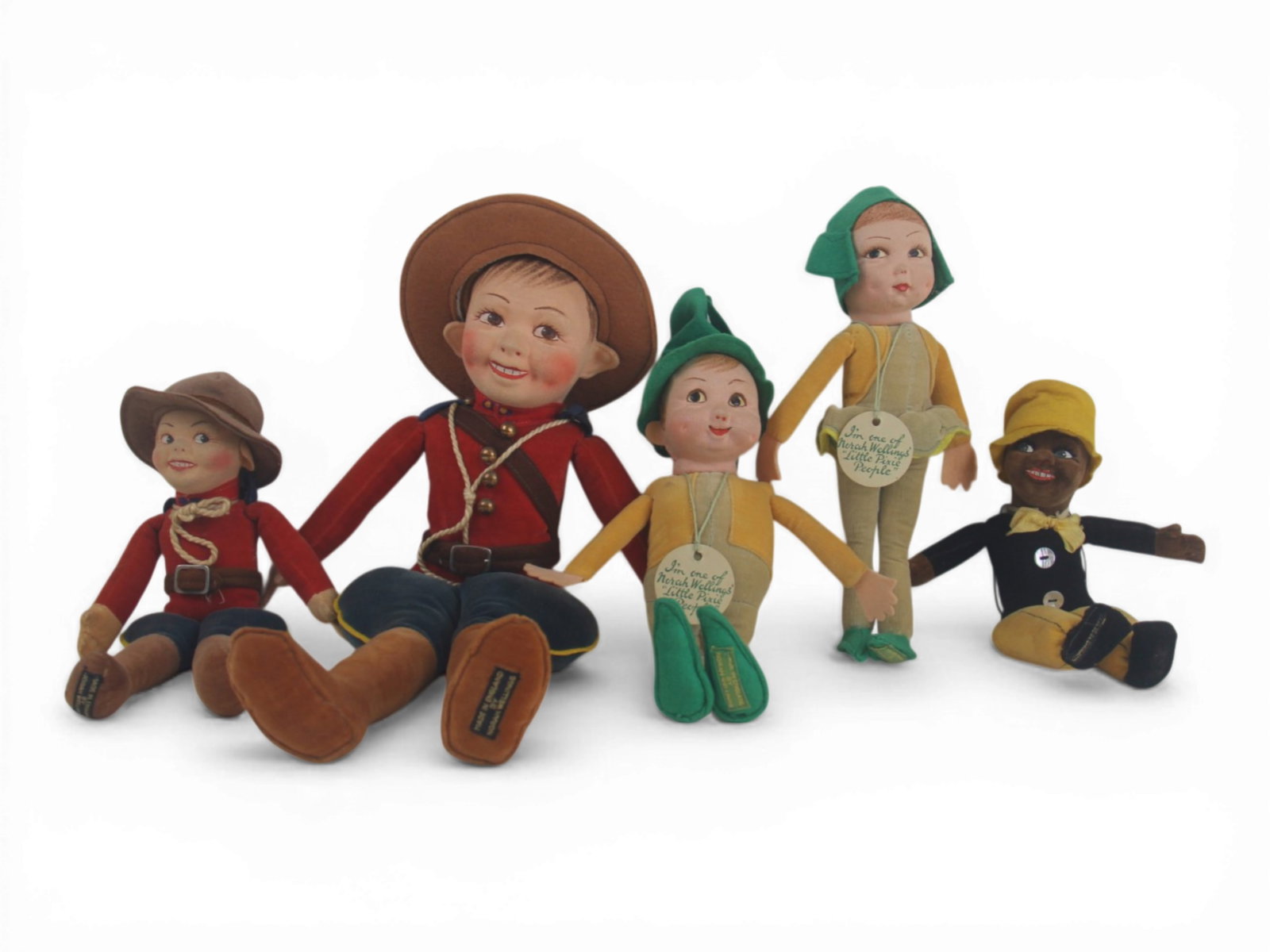 (5) Nora Wellings Felt Dolls: Group of five Nora Wellings dolls measuring 15 to 8 inches including a Canadian Mounted Policeman, two elves, and a small Black doll. Circa 1930s-1940s. Shipping: Weiss Auctions offers full-service, i