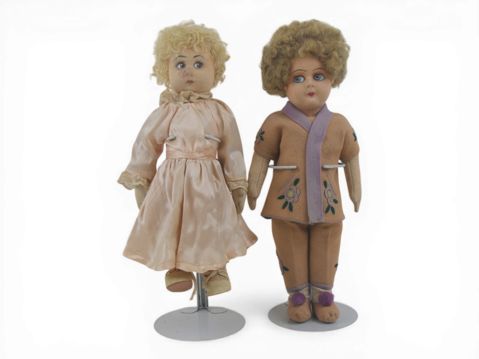 (2) Lenci Type Felt Dolls: Two felt dolls measuring 14 and 12 inches with painted features, one in original costume and one redressed. Possibly early Lenci. Circa 1920s. Shipping: Weiss Auctions offers full-service, in-house