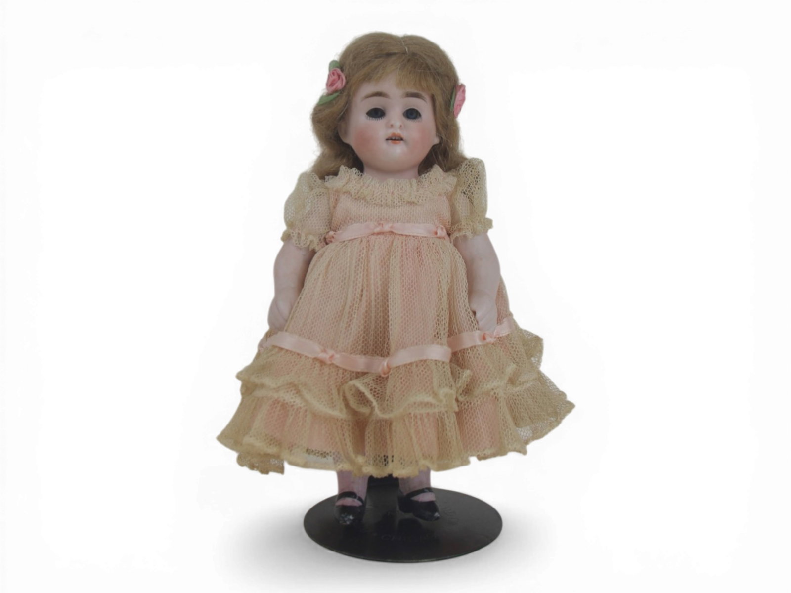 German All Bisque Doll with Costume: 7 inch German all bisque doll jointed at shoulders and hips with painted shoes and socks and original wig. Circa 1900. Shipping: Weiss Auctions offers full-service, in-house shipping for nearly all it