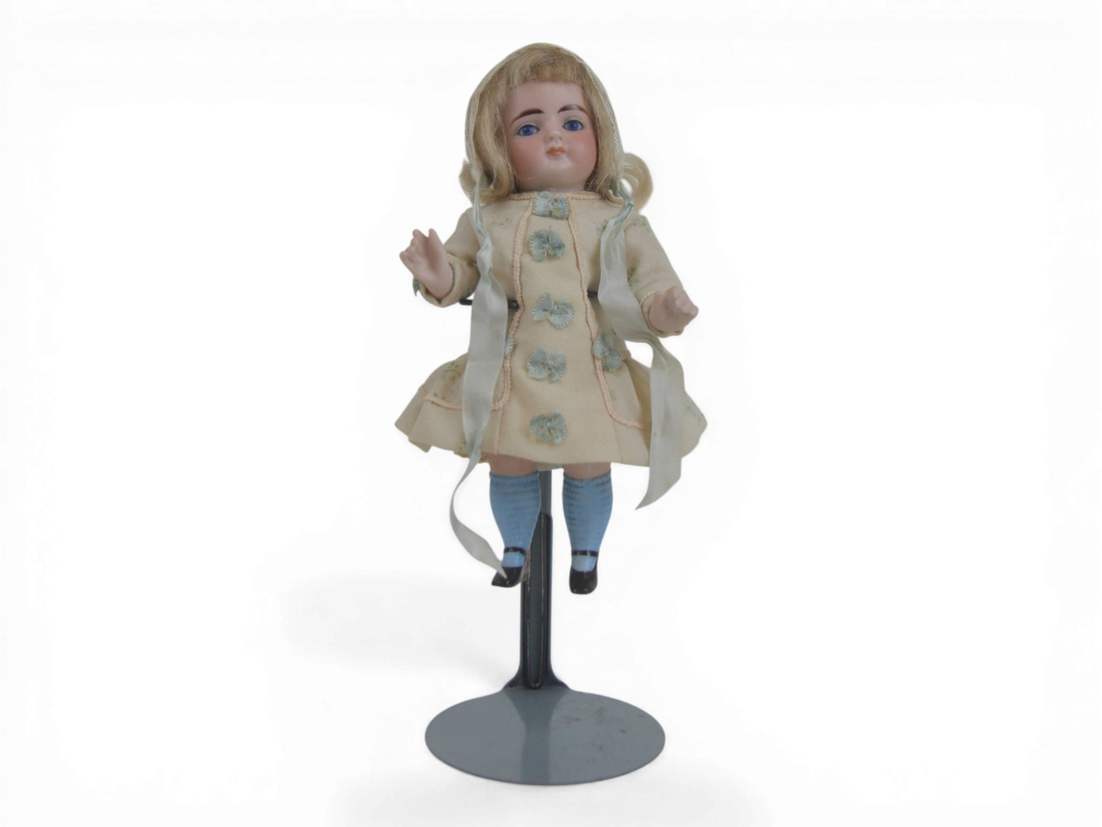 German All Bisque Doll: 7 inch German all bisque doll jointed at neck, arms, and legs with painted socks and single strap high heeled shoes. Circa 1900. Shipping: Weiss Auctions offers full-service, in-house shipping for nea