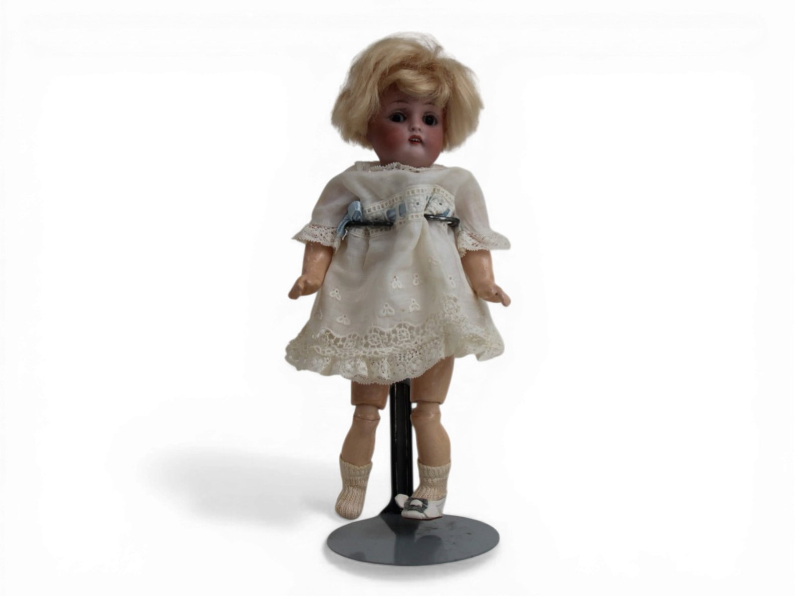 Kestner 155 Bisque Doll: 8 inch Kestner 155 bisque socket head doll on fully jointed composition body. Missing one shoe. Circa 1897. Shipping: Weiss Auctions offers full-service, in-house shipping for nearly all items in