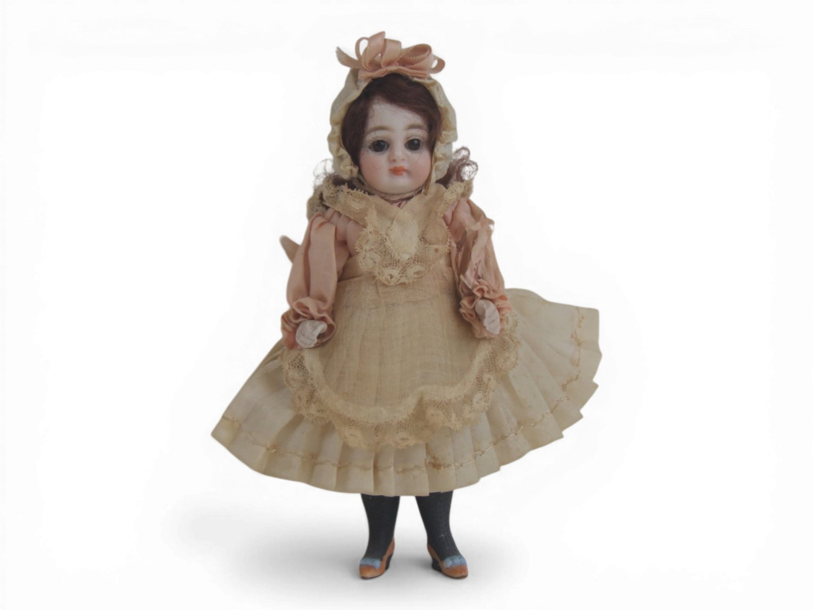 German All Bisque Doll in Antique Dress: 6 inch bisque head doll with stiff neck and jointed limbs. Painted black stockings and high heeled slippers with blue bows. Original dress. Circa 1900. Shipping: Weiss Auctions offers full-service,