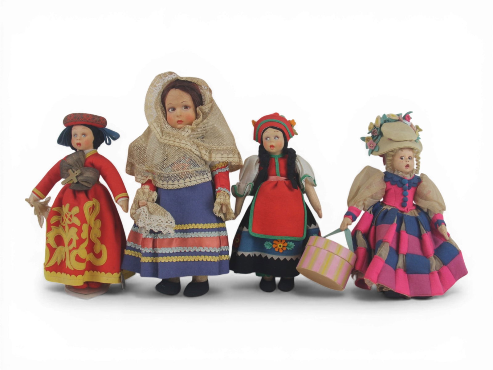 (4) Italian Lenci Souvenir Dolls: Four Italian Lenci felt dolls measuring 11 to 8.5 inches in original regional costumes. Circa 1930. Shipping: Weiss Auctions offers full-service, in-house shipping for nearly all items in this auction