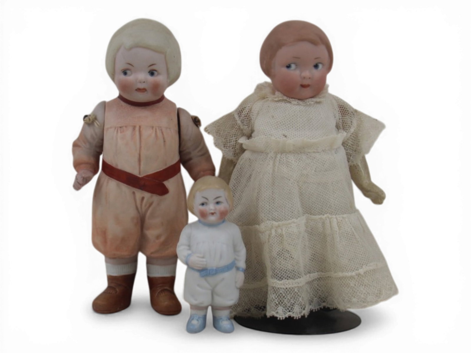 (3) German Bisque Head Dolls: Group including two small all bisque dolls with molded clothing and one Armand Marseille 210 bisque socket head doll on composition body. Circa 1920. Shipping: Weiss Auctions offers full-service, in-h