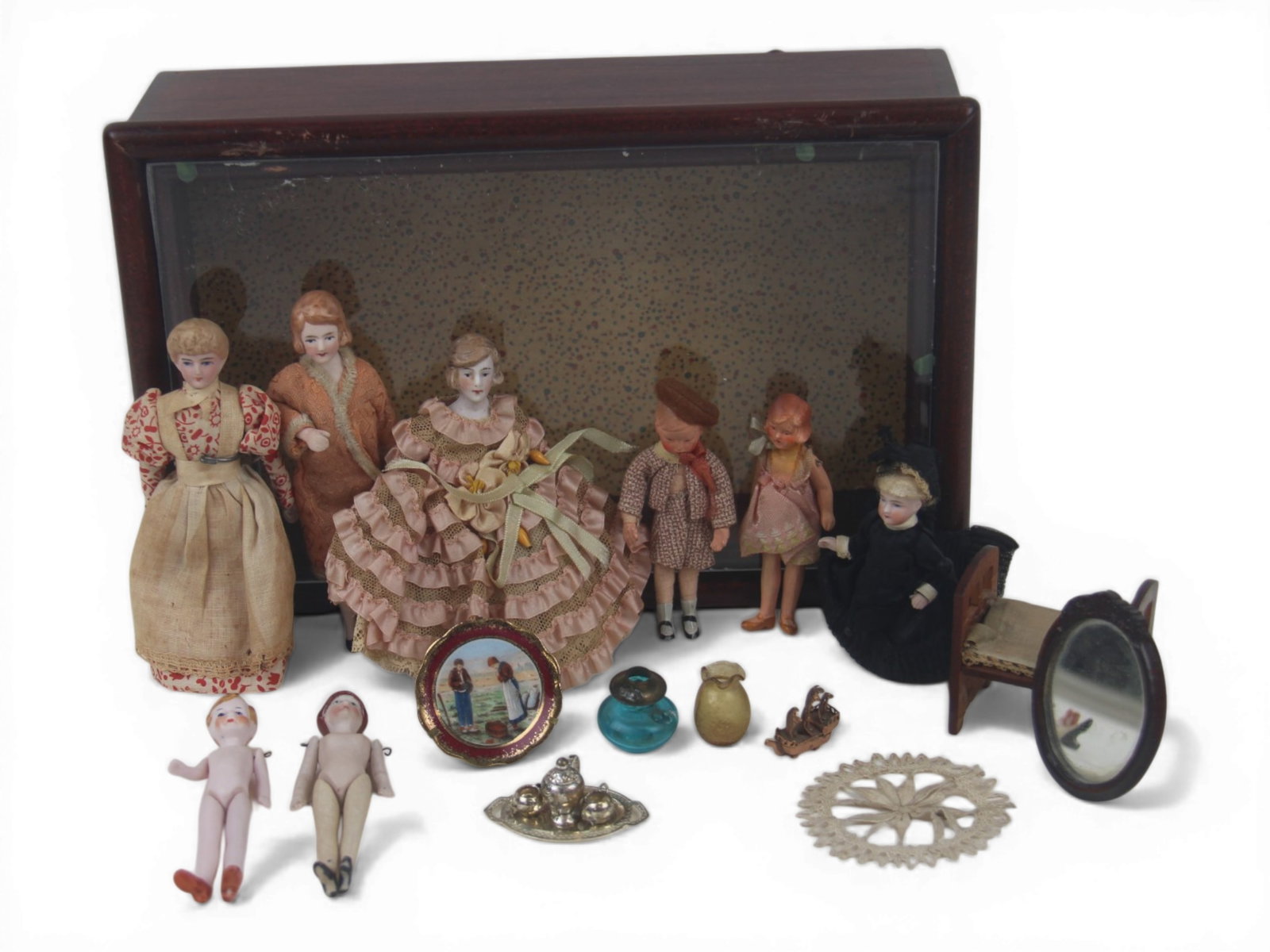 (8) Dollhouse Dolls and Accessories: Eight dollhouse figures and accessories measuring 5 to 3.5 inches including bisque head ladies, all bisque dolls, and children. Circa 1900-1920. Shipping: Weiss Auctions offers full-service, in-house 