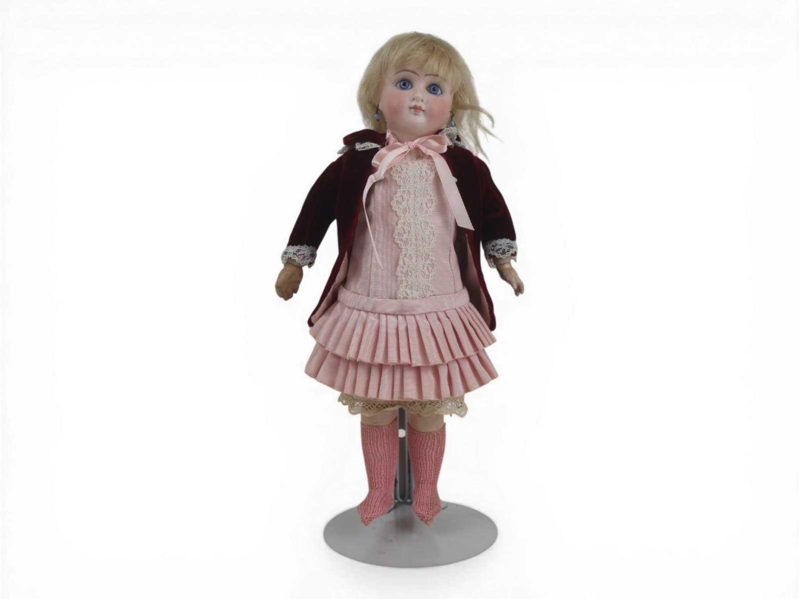German Sonneberg Type Doll: 12 inch bisque socket head doll on fully jointed composition and wood body, redressed with one replaced hand. Circa 1890. Shipping: Weiss Auctions offers full-service, in-house shipping for nearly all
