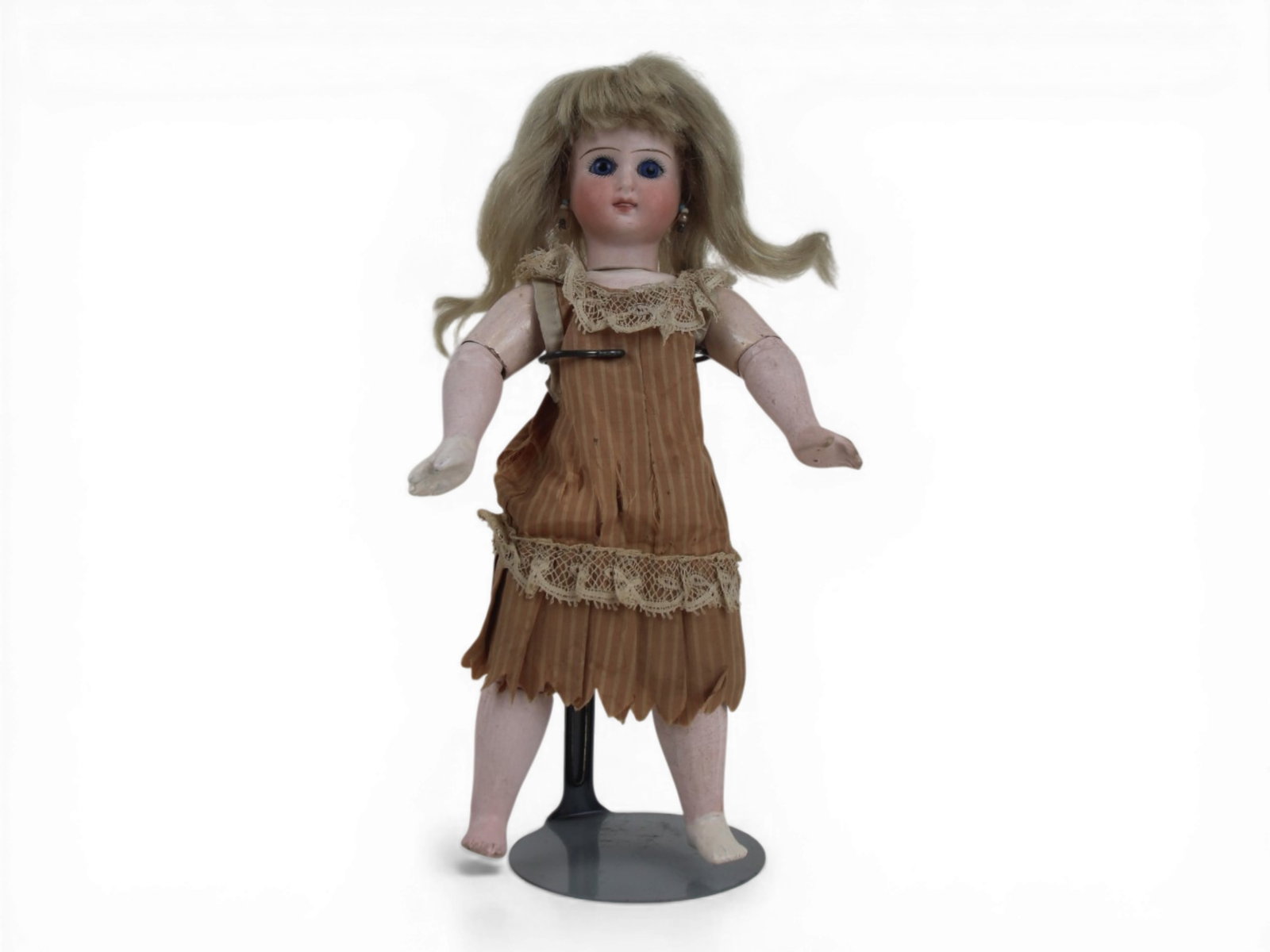 German Bisque Head Doll: 9.5 inch bisque flat cut neck head on fully jointed wooden body. Circa 1890. Shipping: Weiss Auctions offers full-service, in-house shipping for nearly all items in this auction. For a shipping quote,