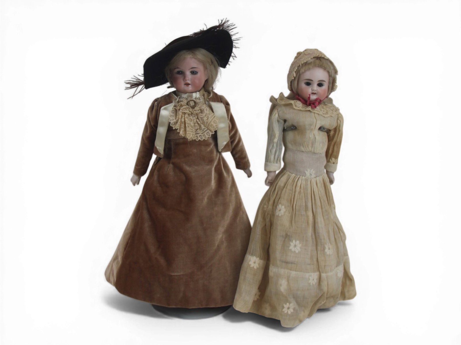(2) German Bisque Head Dolls: Two German bisque shoulder head dolls measuring 14 inches on kidskin bodies with bisque hands. Circa 1890-1910. Shipping: Weiss Auctions offers full-service, in-house shipping for nearly all items in 