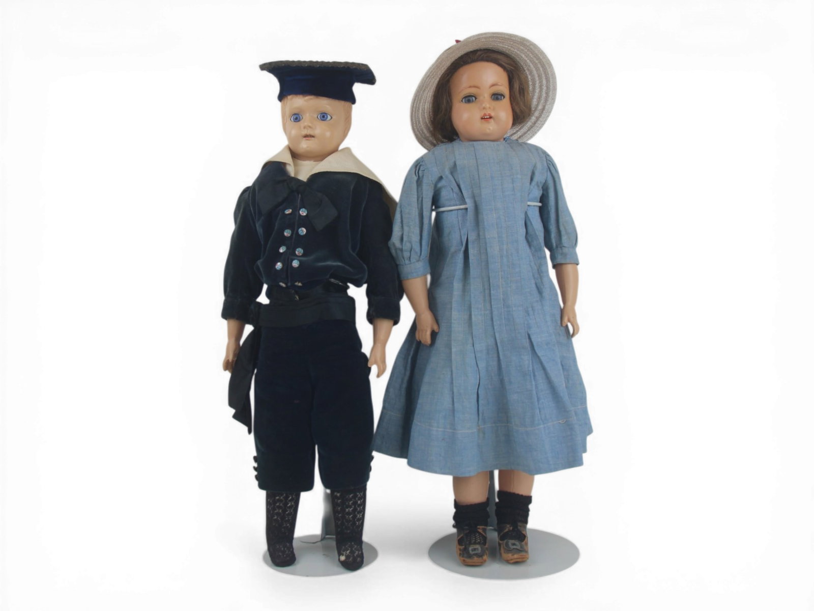 (2) German Celluloid Dolls: Two German celluloid dolls measuring 19 inches with shoulder heads and original costumes. Circa 1890. Shipping: Weiss Auctions offers full-service, in-house shipping for nearly all items in this aucti