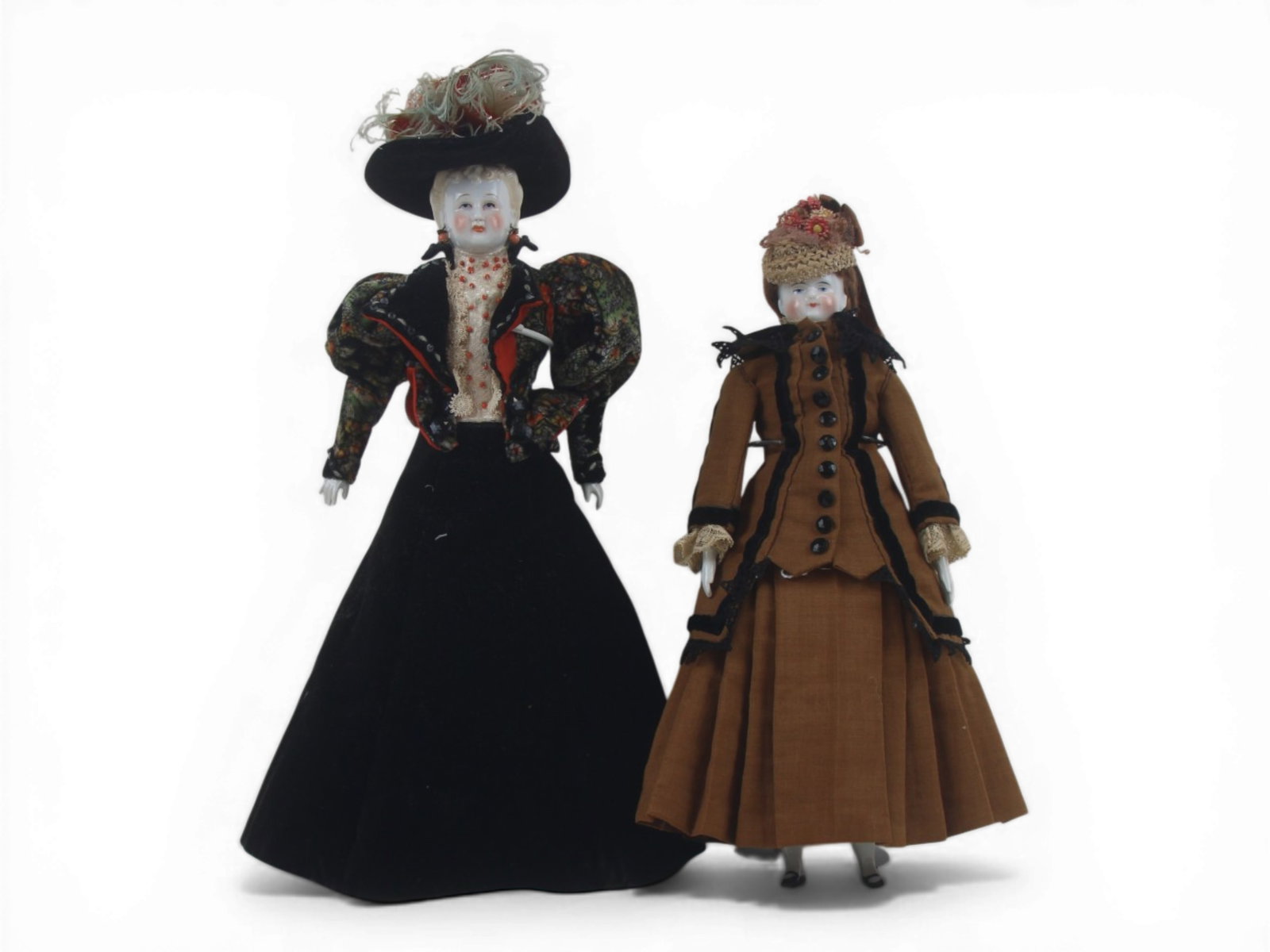 (2) China Head Dolls: 13.5 inch Japanese lady china head doll and a 12 inch German china head doll with replaced body. Circa 1860-1920s. Shipping: Weiss Auctions offers full-service, in-house shipping for nearly all items 