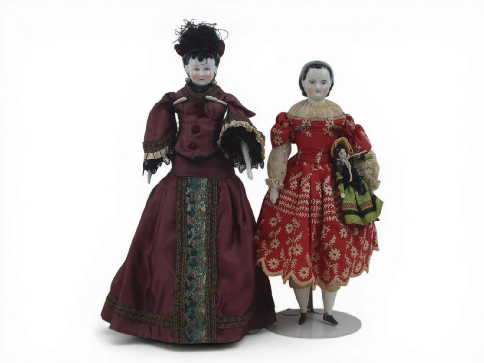(2) German China Head Dolls: Two china head dolls including Japanese style example and possible Alice in Wonderland reproduction. Circa 1850-1930. Shipping: Weiss Auctions offers full-service, in-house shipping for nearly all ite