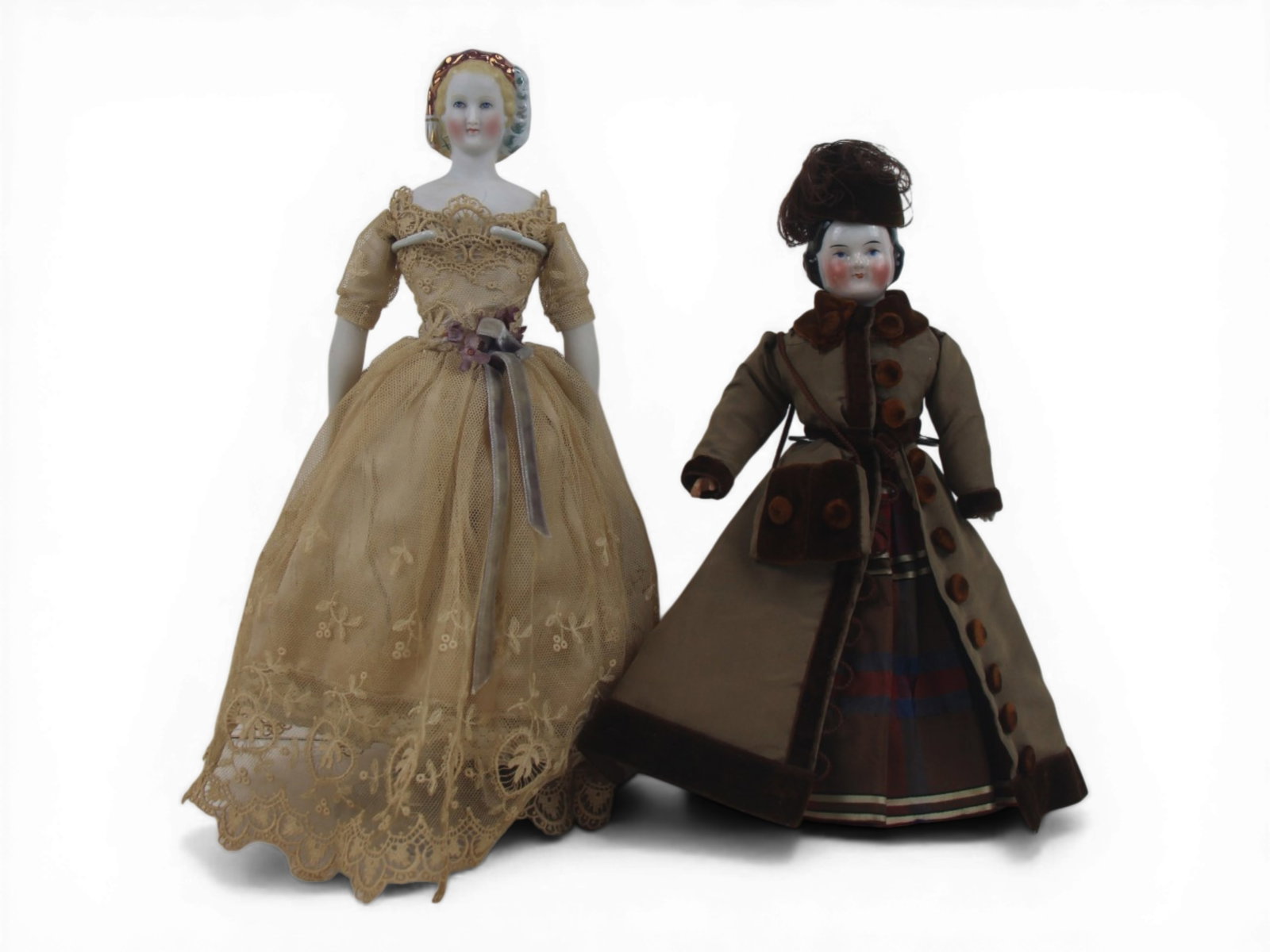(2) China Head Lady Dolls: Two china head lady dolls including Parian example with snood and Covered Wagon type doll. Circa 1870. Shipping: Weiss Auctions offers full-service, in-house shipping for nearly all items in this auct