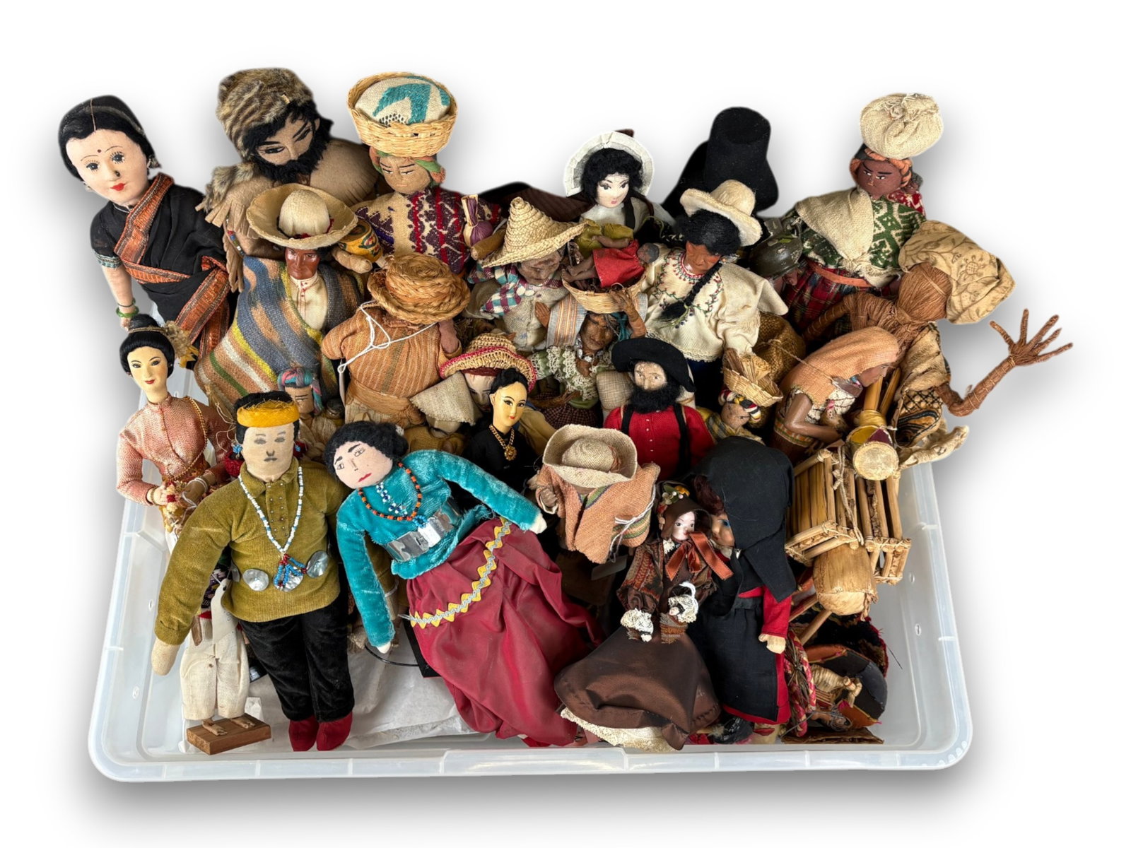 (30) Souvenir Dolls & Accessories: Group of 30 miscellaneous souvenir dolls and accessories. Circa 1920s-1970s. Shipping: Weiss Auctions offers full-service, in-house shipping for nearly all items in this auction. For a shipping quote,