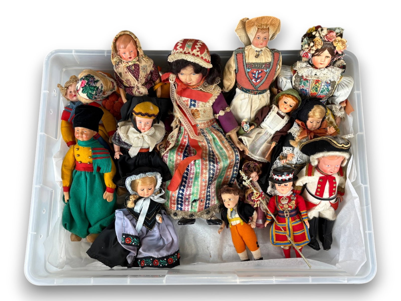 (15) Souvenir Dolls: Group of 15 miscellaneous souvenir dolls, mostly celluloid and hard plastic, in regional costumes. Approx. 4 to 14 inches. Circa 1920s-1960s. Shipping: Weiss Auctions offers full-service, in-house