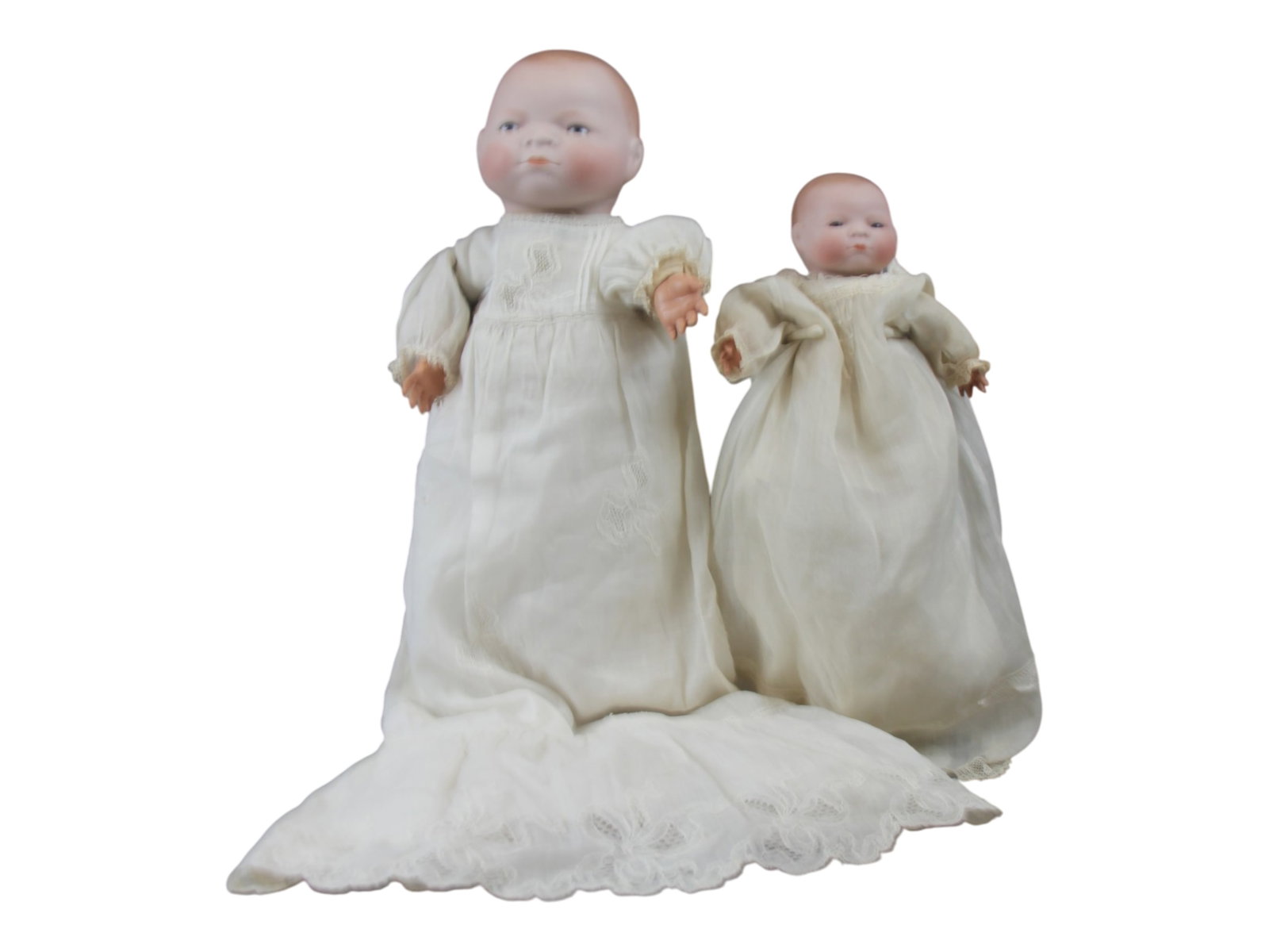 (2) Bye-Lo Babies: Two Bye-Lo Baby dolls with bisque flange heads on cloth bodies with celluloid hands. Measuring 9 to 14 inches. Circa 1920. Shipping: Weiss Auctions offers full-service, in-house shipping for nearly al