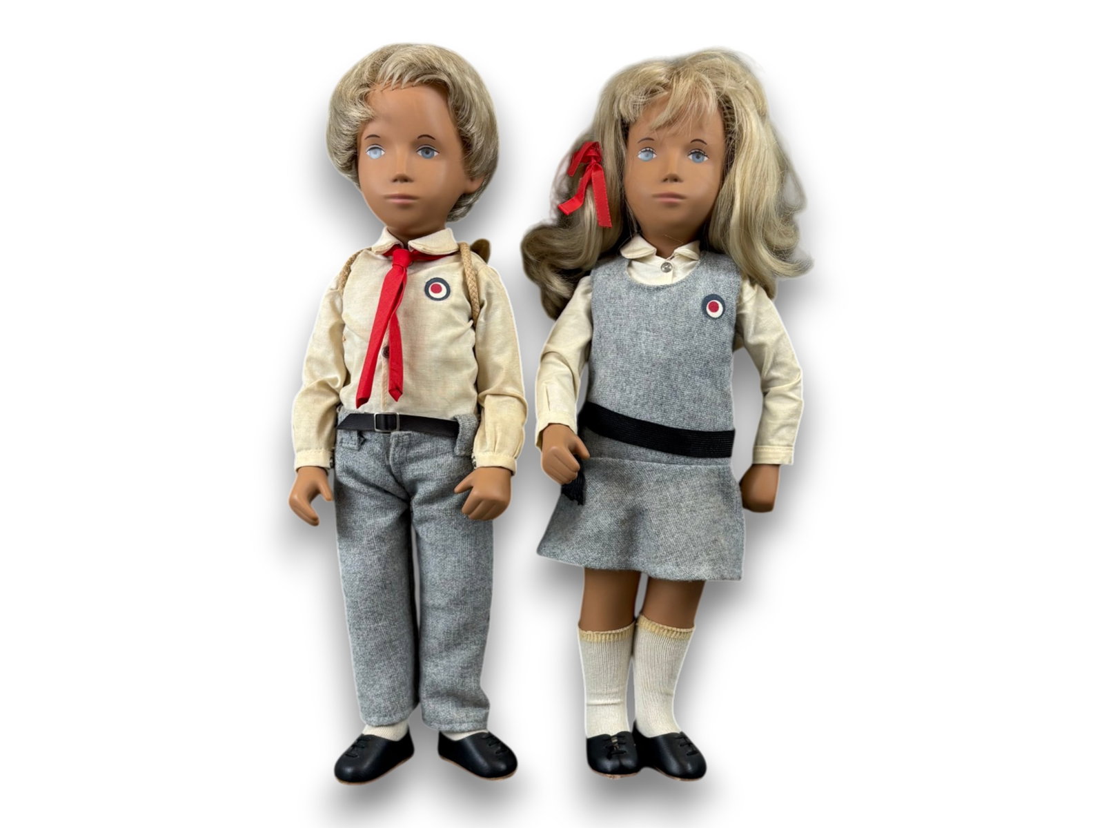 (2) Vintage Sasha Dolls: 20th anniversary blonde Sasha and Gregor dolls in original school outfits. Measuring 20 inches. Circa 1985. Shipping: Weiss Auctions offers full-service, in-house shipping for nearly all items in