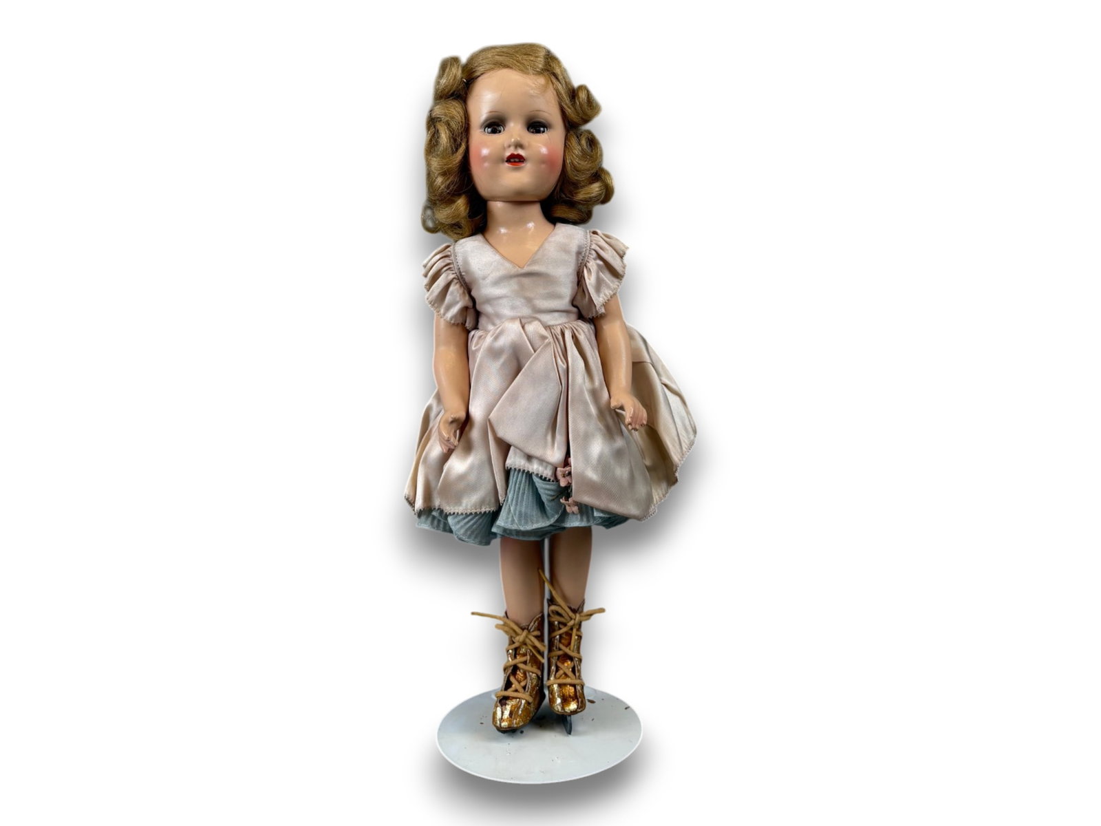 Sonja Henie Doll by Madame Alexander: 14 inch composition doll with mohair wig in original costume and original box. Circa 1940s. Shipping: Weiss Auctions offers full-service, in-house shipping for nearly all items in this auction. For a 