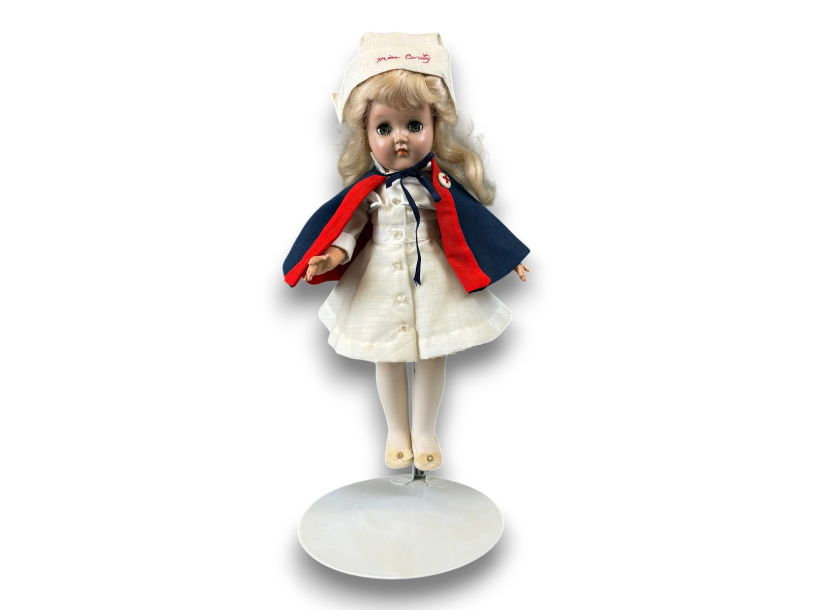 Toni Doll "Miss Curity": 14 inch hard plastic Toni doll with Dynel wig in original nurse costume. Circa 1940s. Shipping: Weiss Auctions offers full-service, in-house shipping for nearly all items in this auction. For a shippi