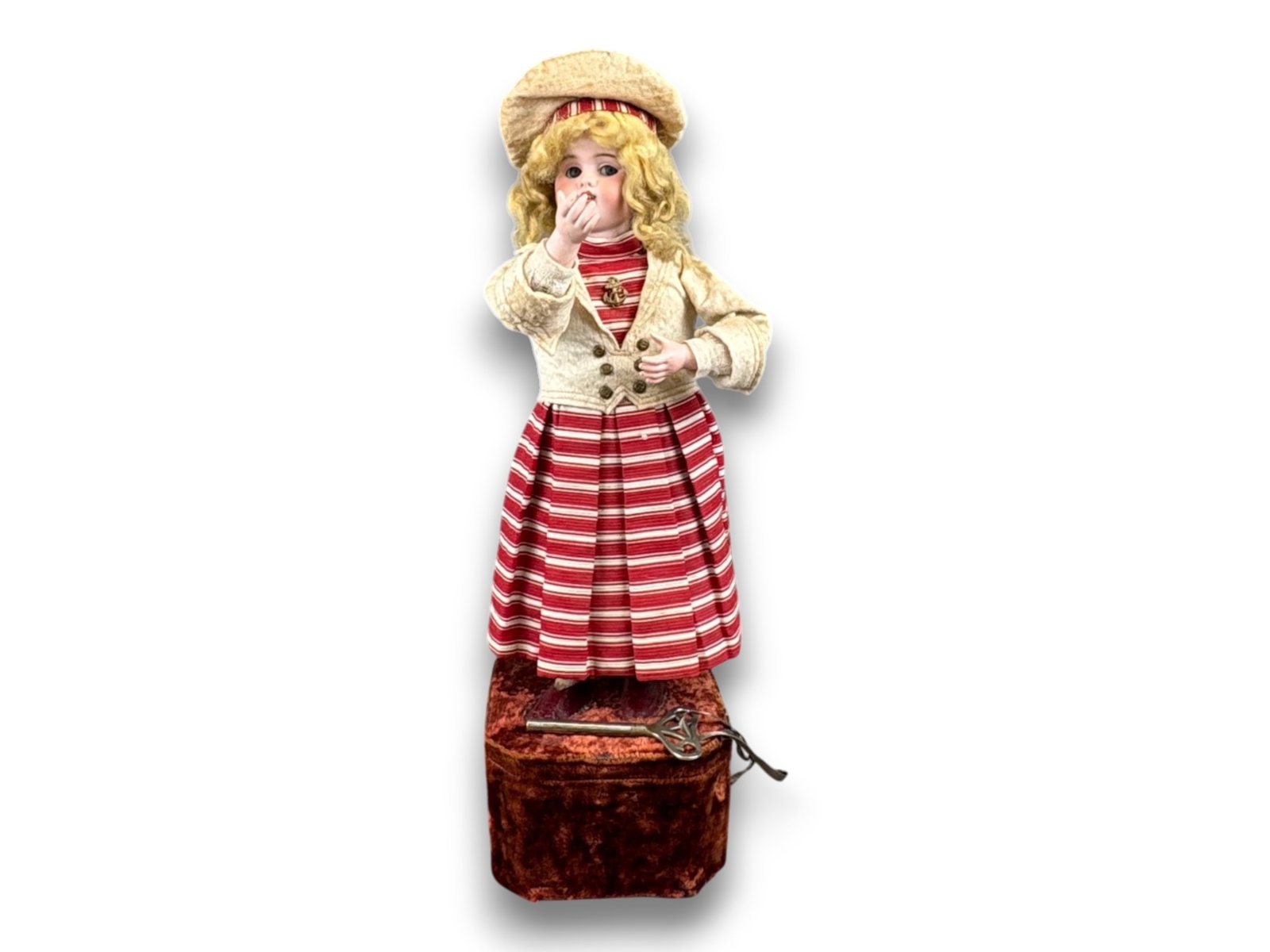 French Automaton with German Head: 20 inch musical automaton with 15 inch doll having Simon and Halbig #1300-6 flat base head, bisque arms, mohair wig, and French mechanism. Working with original key. Circa 1900. Shipping: Weiss Auctio