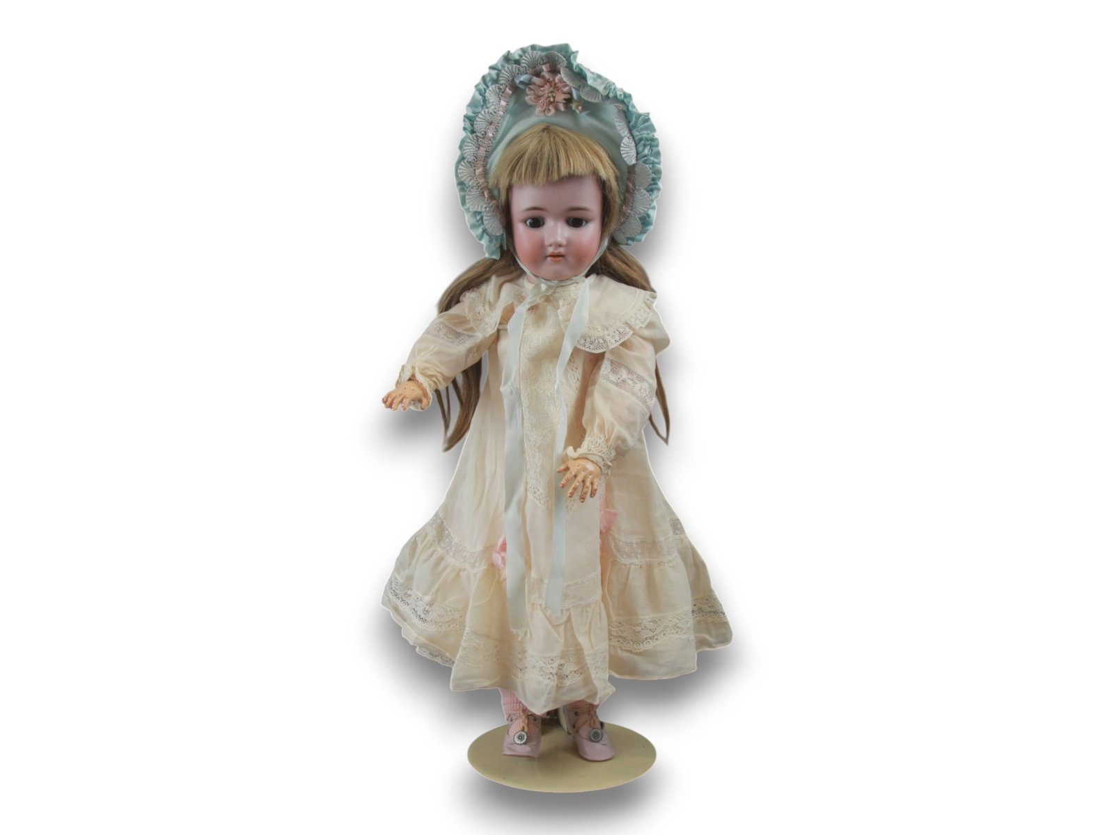 Handwerck / Halbig Doll: 24 inch Handwerck / Halbig bisque socket head doll on fully jointed composition body with antique human hair wig and dress. Circa 1900. Shipping: Weiss Auctions offers full-service, in-house shipping