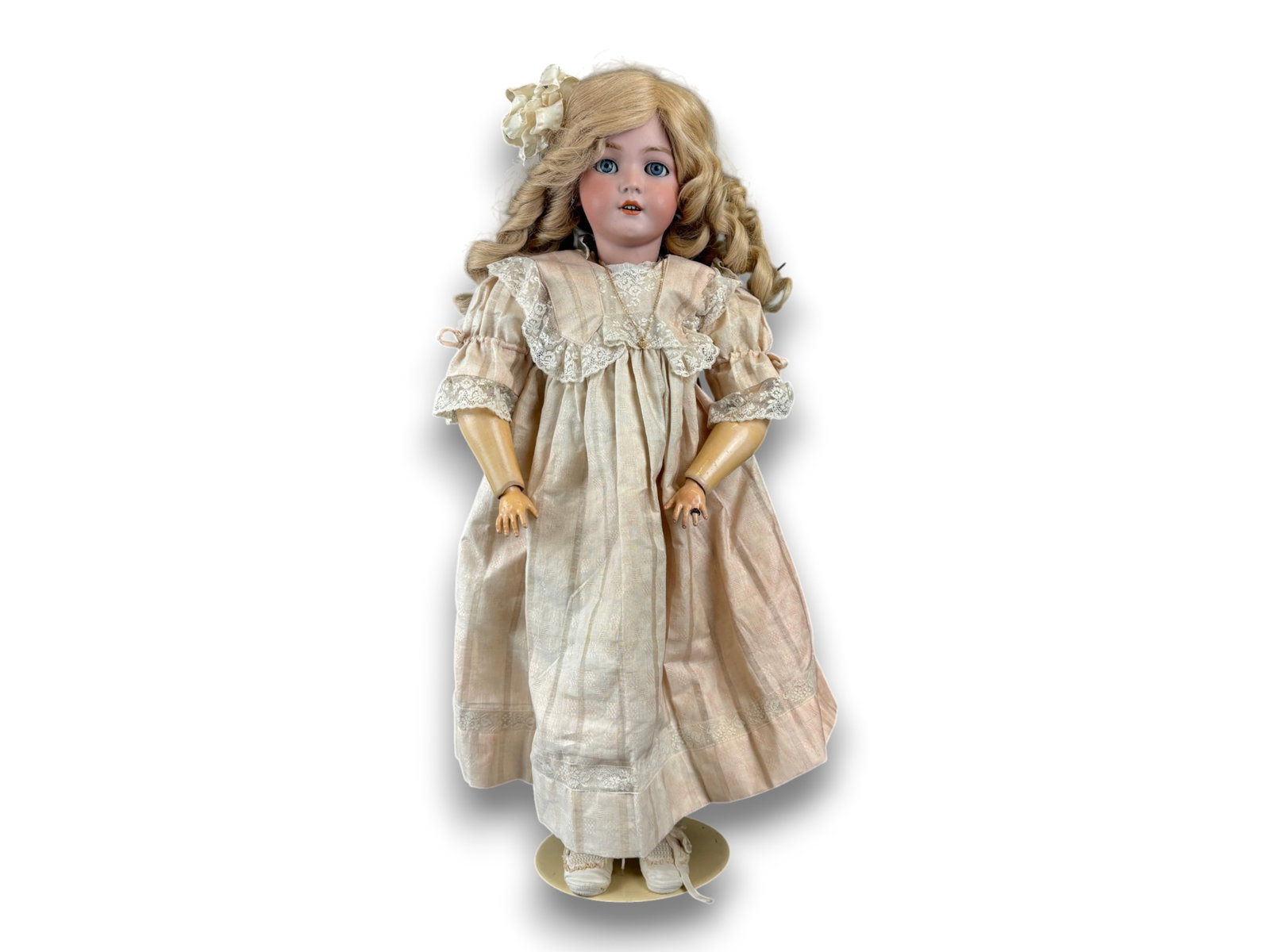 S&H Santa Doll: 30 inch Simon and Halbig Santa doll with bisque socket head on composition and wood body. Marked 1248. Antique dress and blond human hair wig. Circa 1895. Shipping: Weiss Auctions offers full-service,