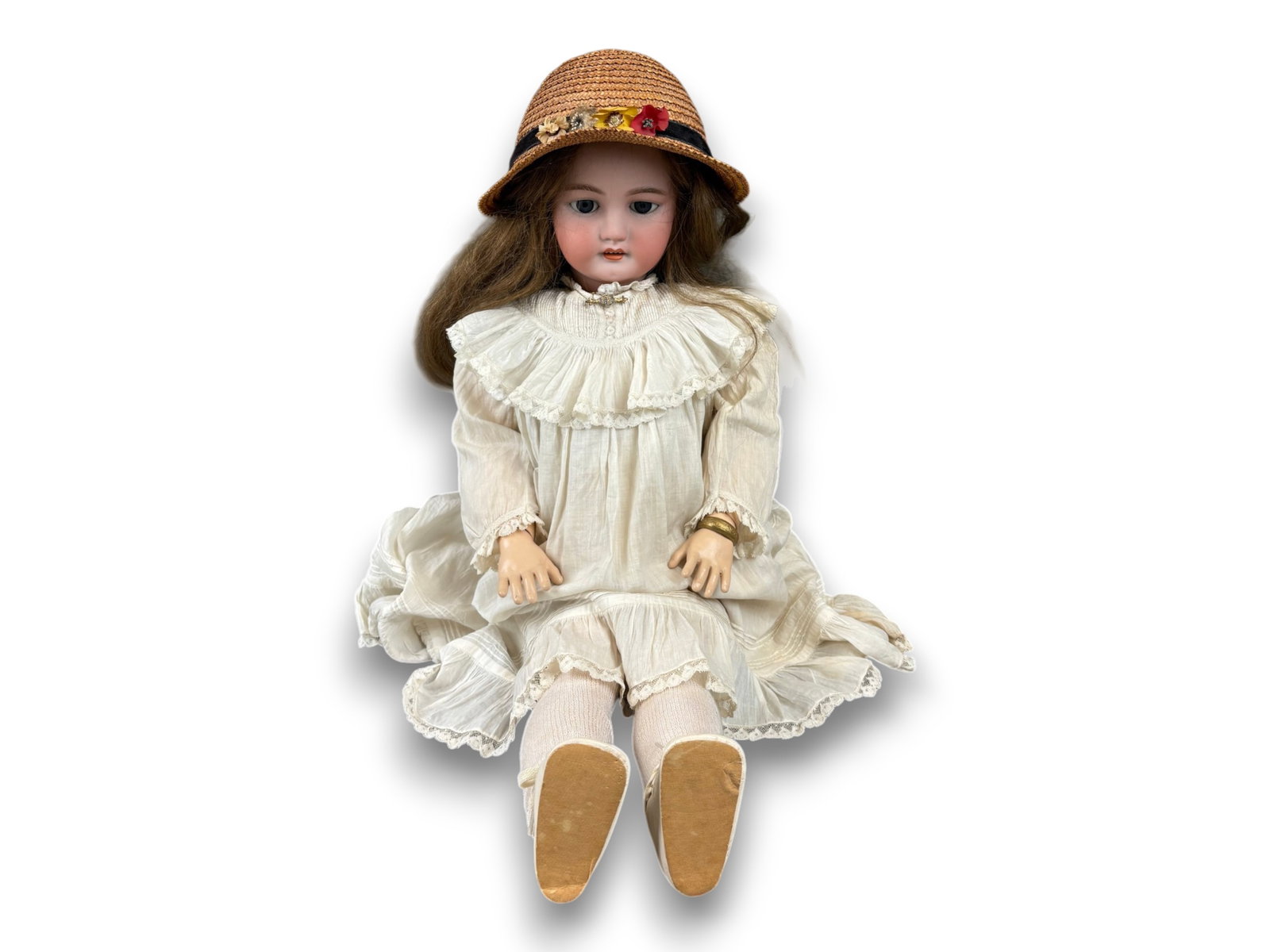 C.M. Bergmann Doll: 31 inch C.M. Bergmann bisque socket head doll on fully jointed composition and wood child body with human hair wig and antique clothing. Circa 1900. Shipping: Weiss Auctions offers full-service,