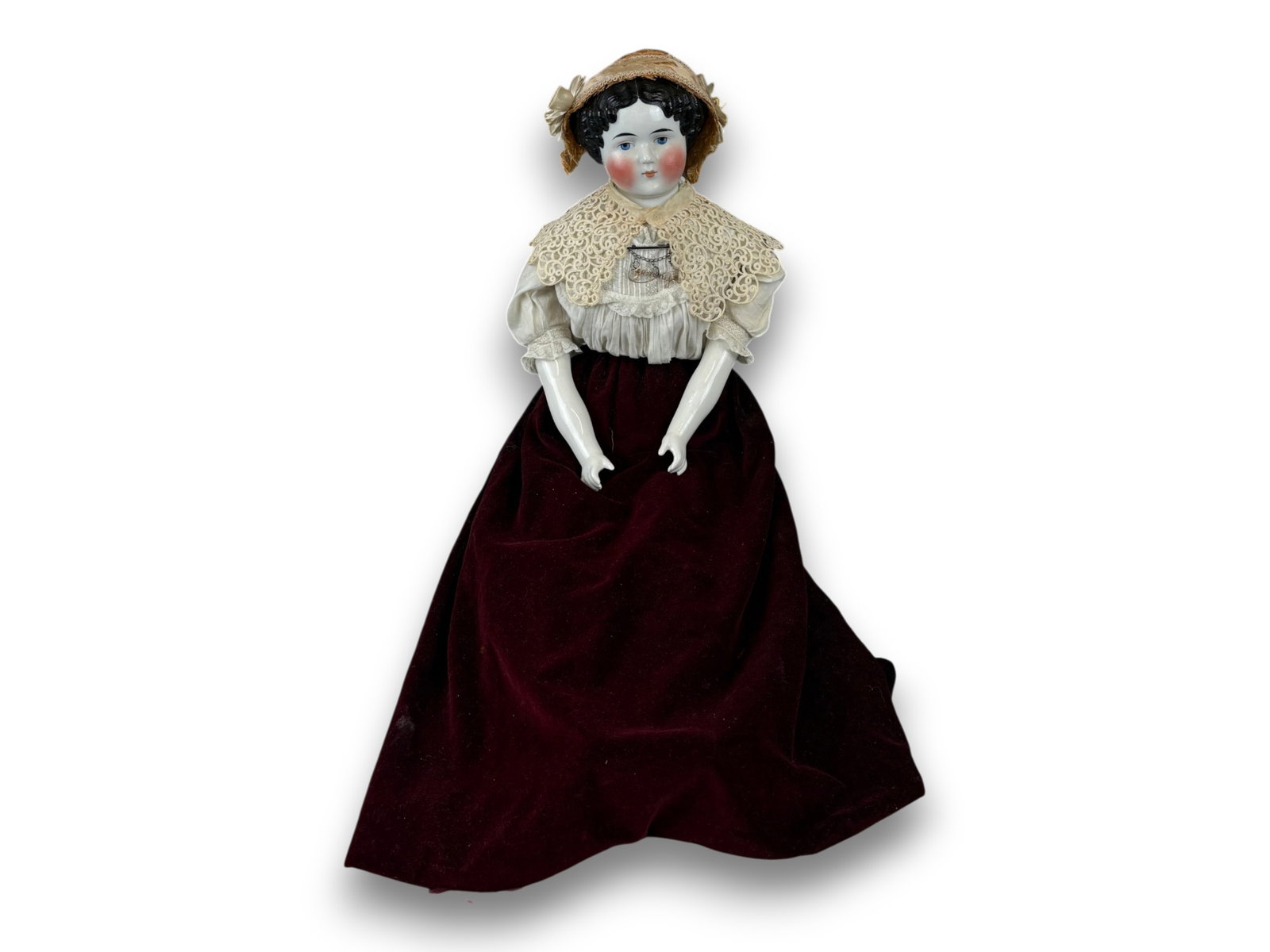 German China Head Doll: 37 inch German china shoulder head doll on cloth body with replaced china limbs, nicely dressed with jewelry. Circa 1870s. Shipping: Weiss Auctions offers full-service, in-house shipping for nearly al