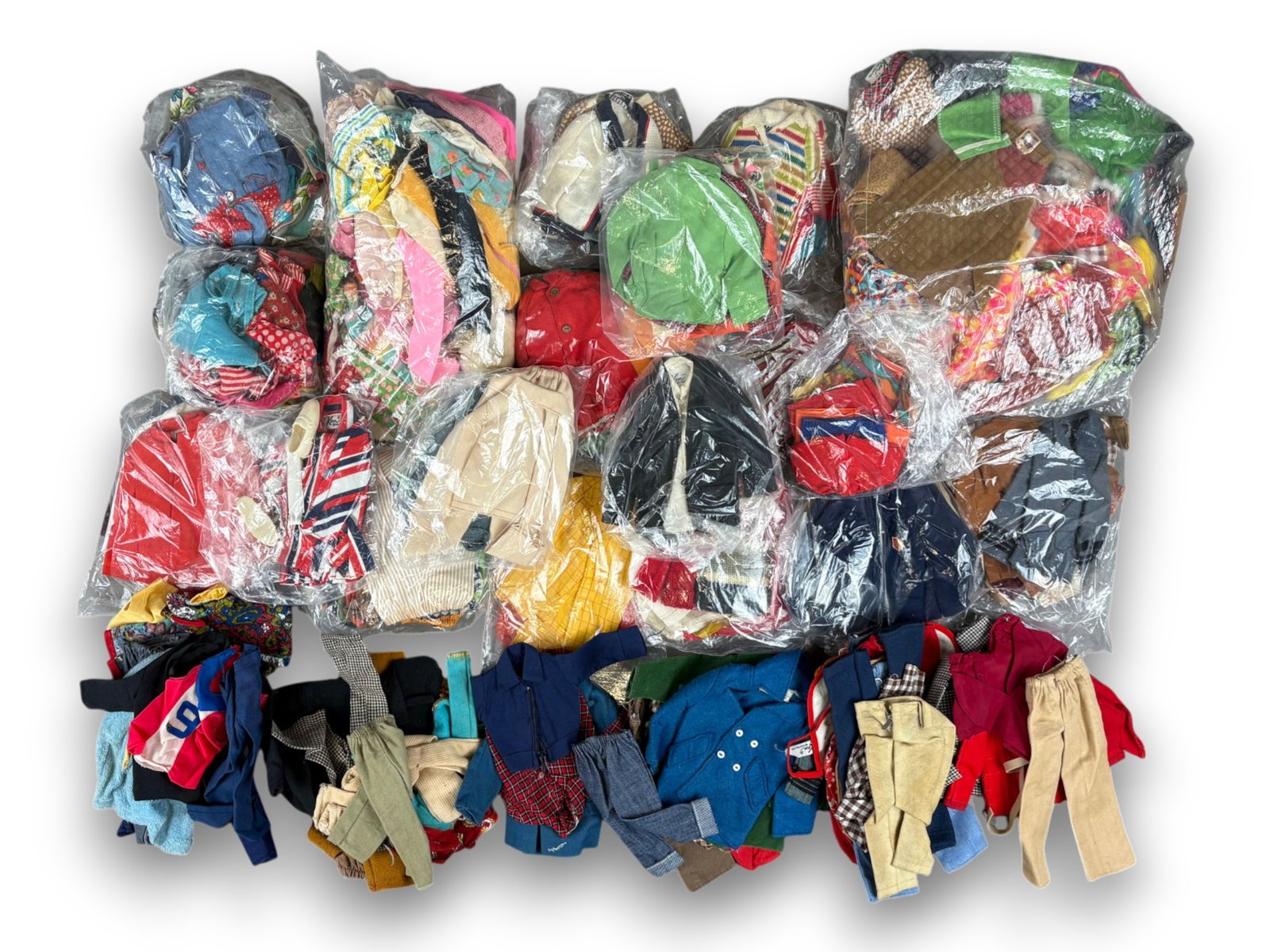 Estate Lot of Barbie, Ken & Skipper Fashions: Offered is a large lot of Fashion Outfits for Barbie, Ken, and Skipper by Mattel. Unsure if all are complete as these have not been collated. Great lot, worth examining. Most are tagged, some may not 