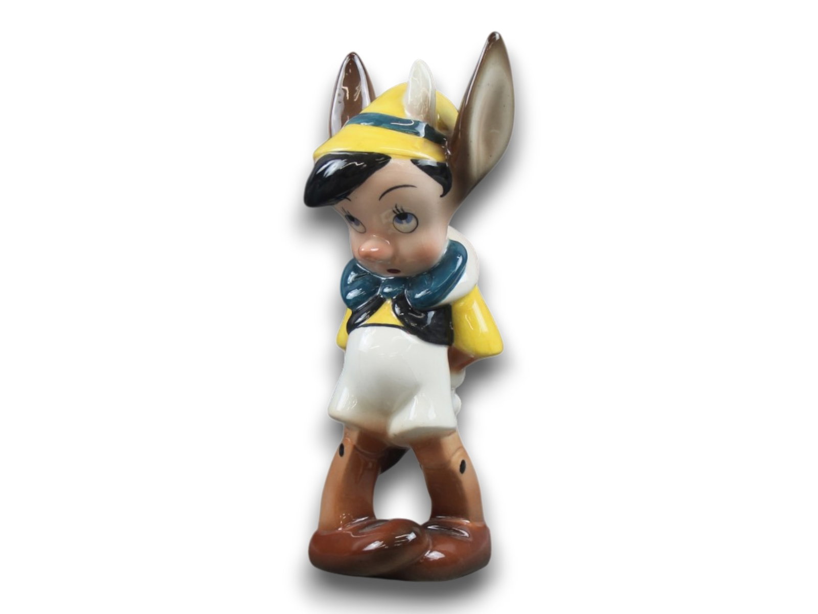 Zaccagnini. Pinocchio With Donkey Ears.: 7 3/4" Tall. Excellent Shipping: Weiss Auctions offers full-service, in-house shipping for nearly all items in this auction. For a shipping quote, please contact us prior to the sale at info@weissauct